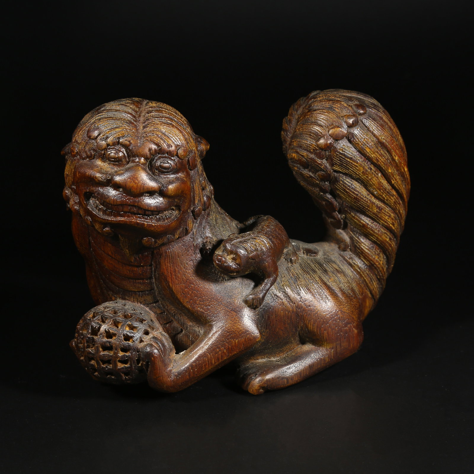 A QINAN WOOD LARGE AND SMALL LION FIGURINES (1 of 8)
