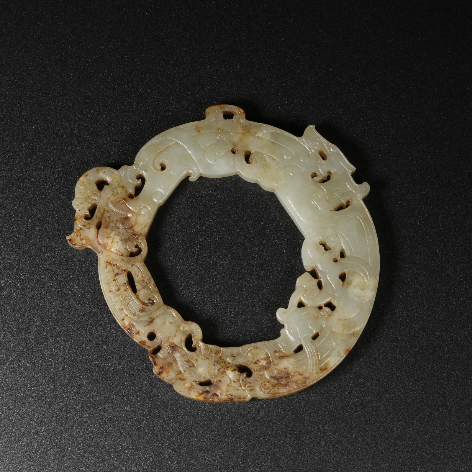 A ARCHAIC JADE RING WITH DRAGON MOTIF (1 of 7)
