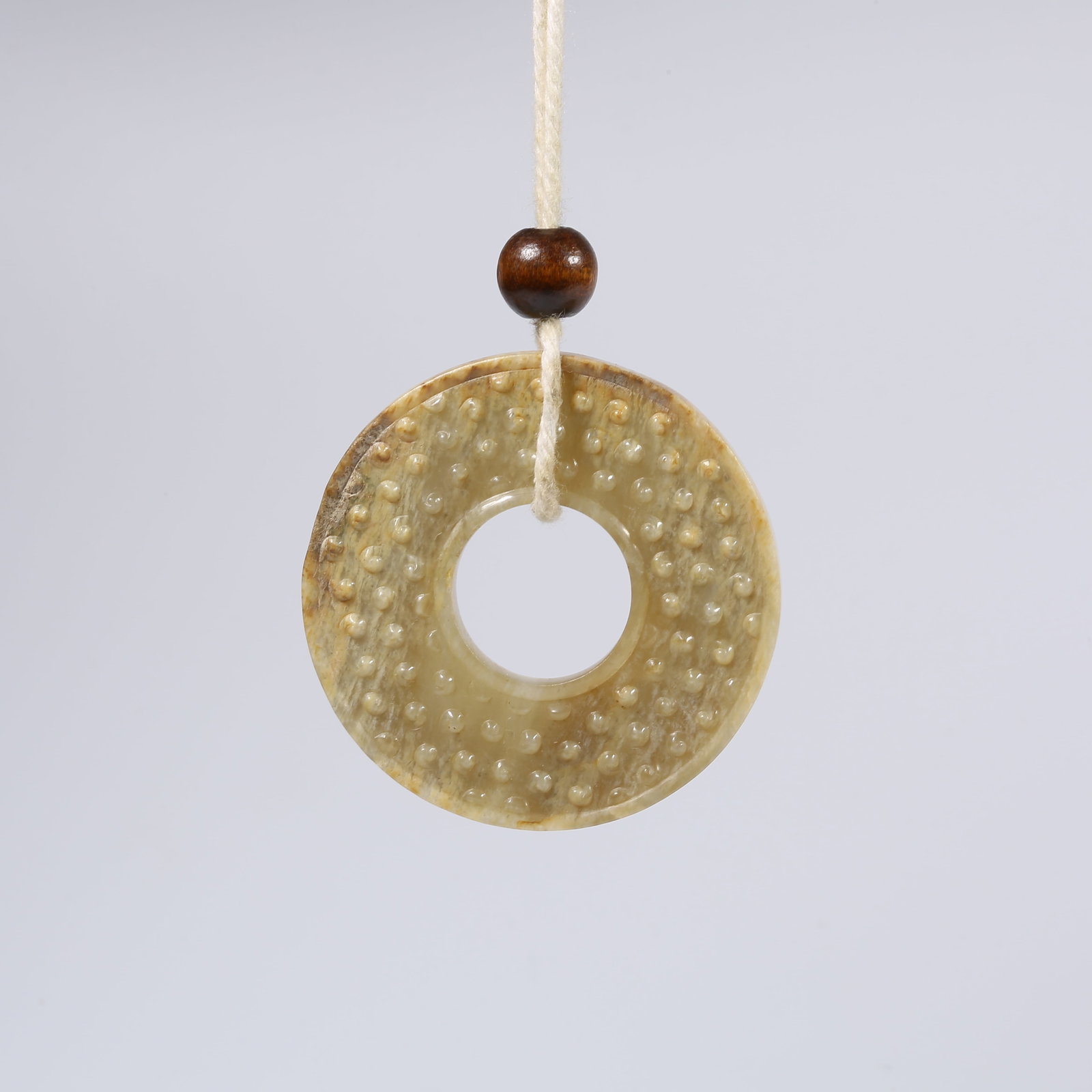 A ANCIENT JADE BI DISK WITH GRAIN PATTERN (1 of 8)