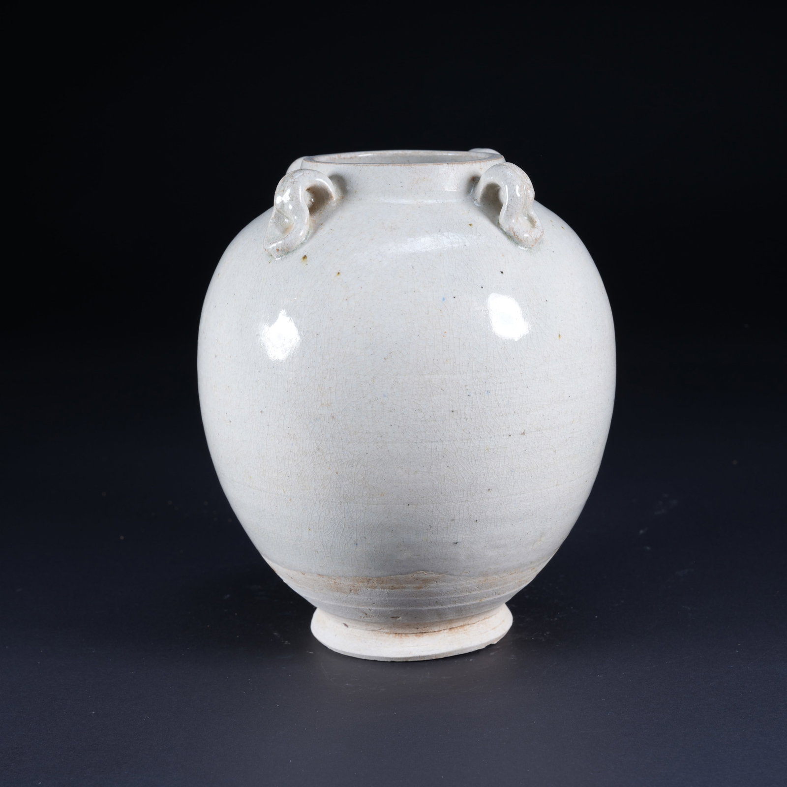 A WHITE-GLAZED JAR WITH FOUR LOOP HANDLES: White-Glazed Jar with Four Loop Handles