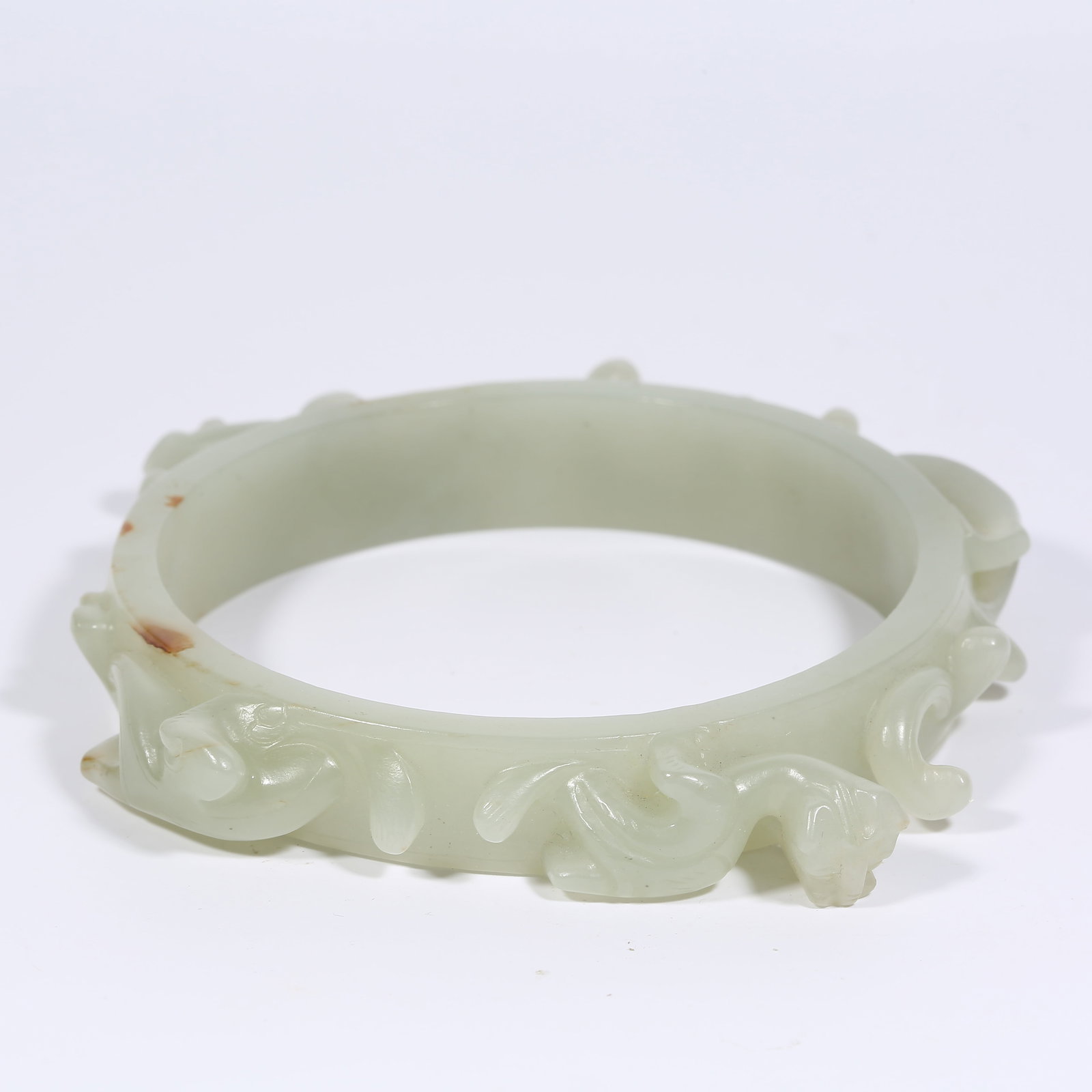 A ANCIENT JADE ARMLET WITH CHI-DRAGON MOTIF (1 of 10)