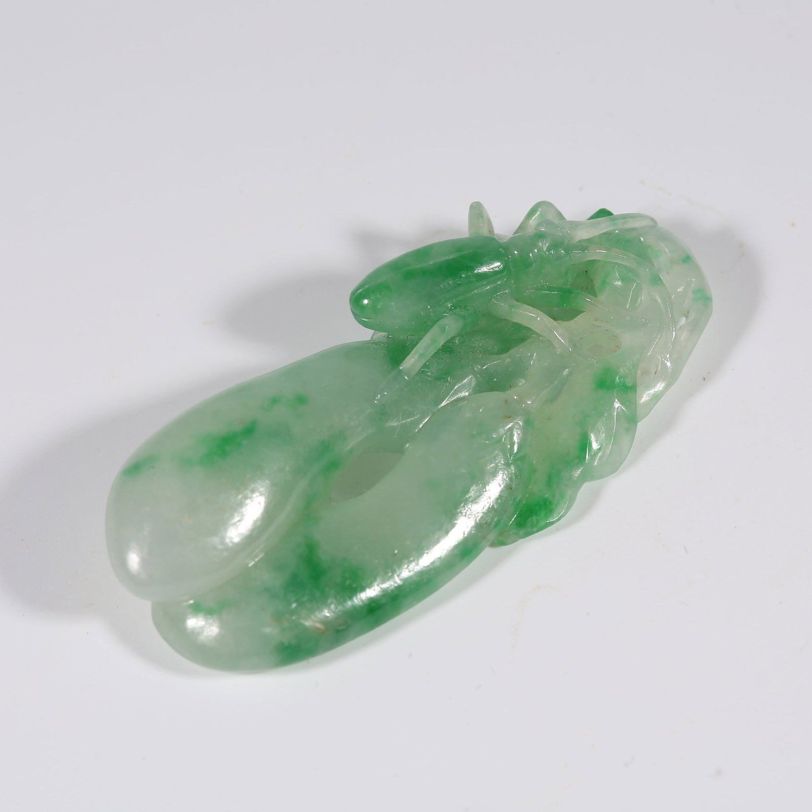 A JADEITE PENDANT WITH LUCKY MELON MOTIF (1 of 8)