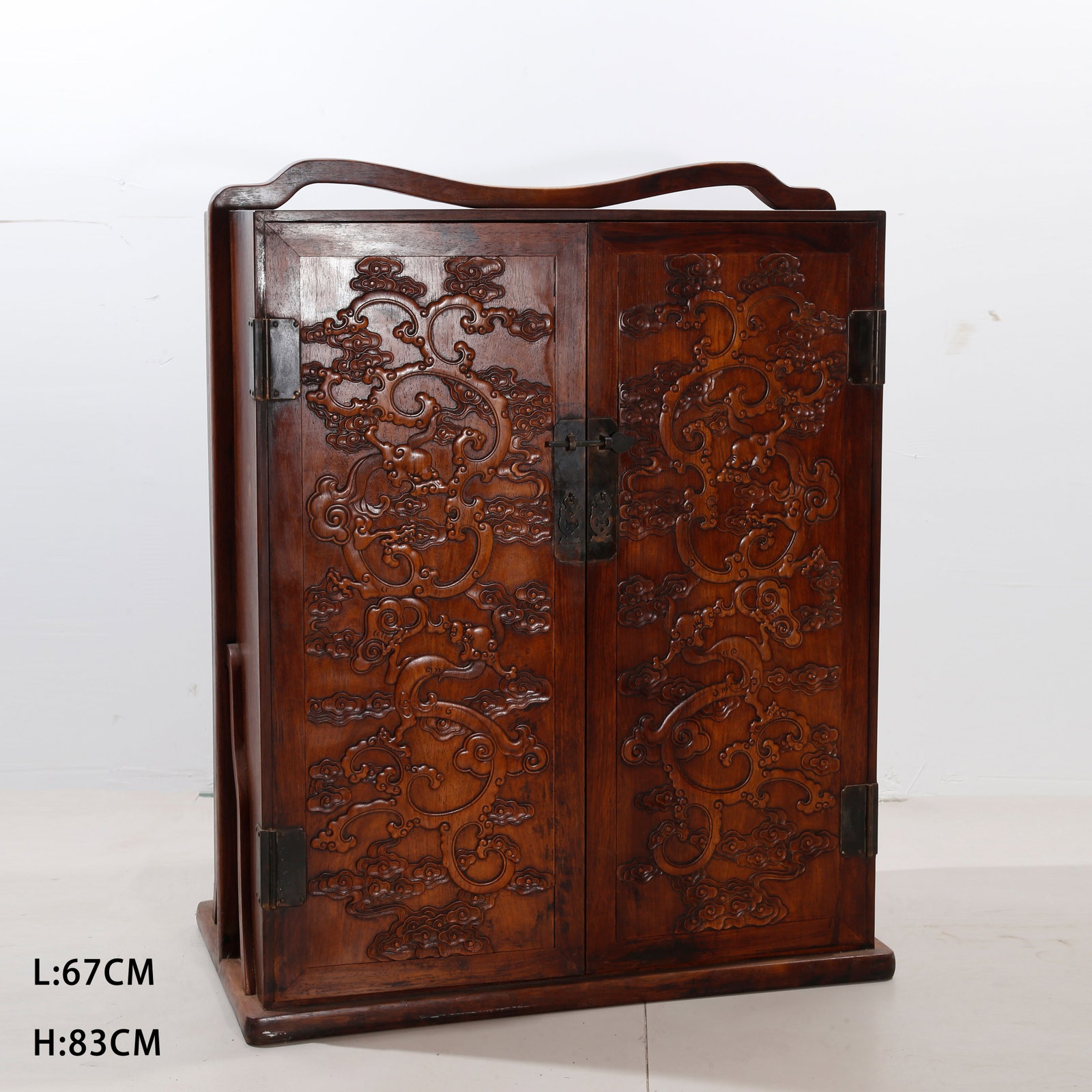 A LARGE HUANGHUALI PORTABLE BOX WITH CLOUD-AND-DRAGON DESIGN: Large Huanghuali Portable Box with Cloud-and-Dragon Design