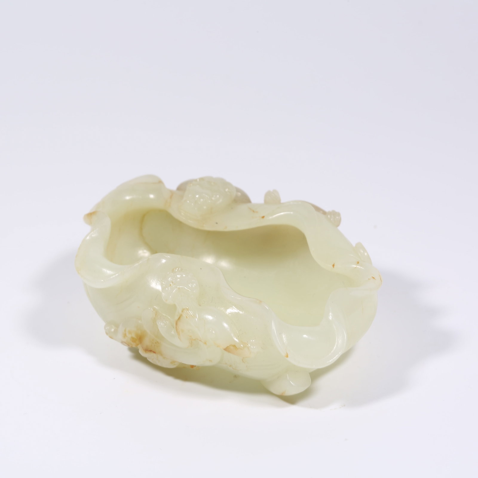 A HETIAN WHITE JADE LOTUS-LEAF BRUSH WASHER WITH CHI-DRAGON MOTIF: Hetian White Jade Lotus-Leaf Brush Washer with Chi-Dragon Motif