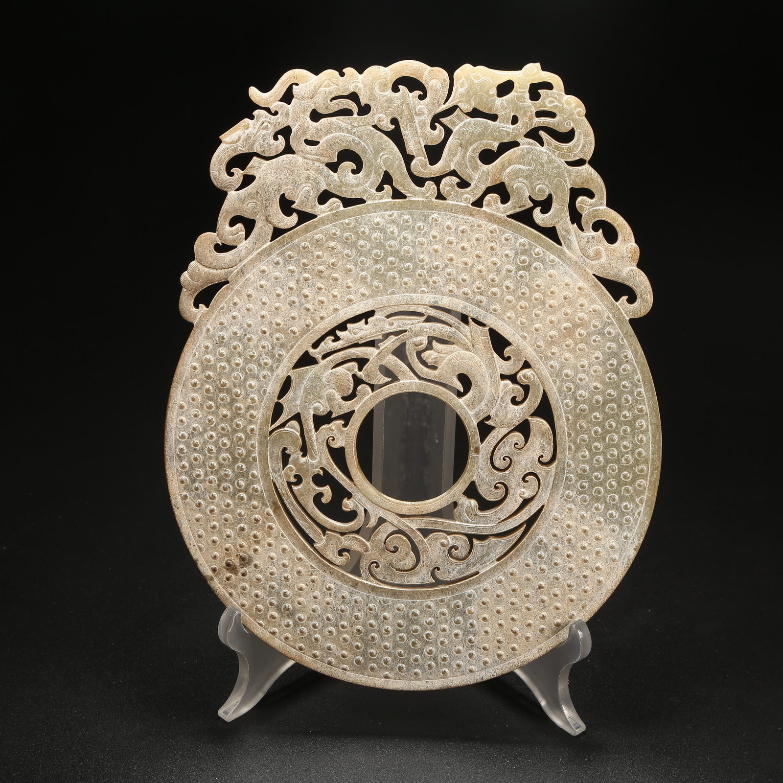 A ANCIENT JADE DRAGON-PATTERNED BI WITH RAISED RIM: Ancient Jade Dragon-Patterned Bi with Raised Rim