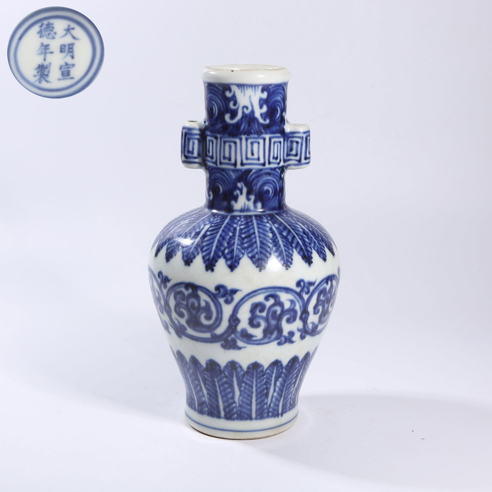 A BLUE-AND-WHITE LOTUS-AND-FLOWER PATTERNED LUG-HANDLED VASE (1 of 9)