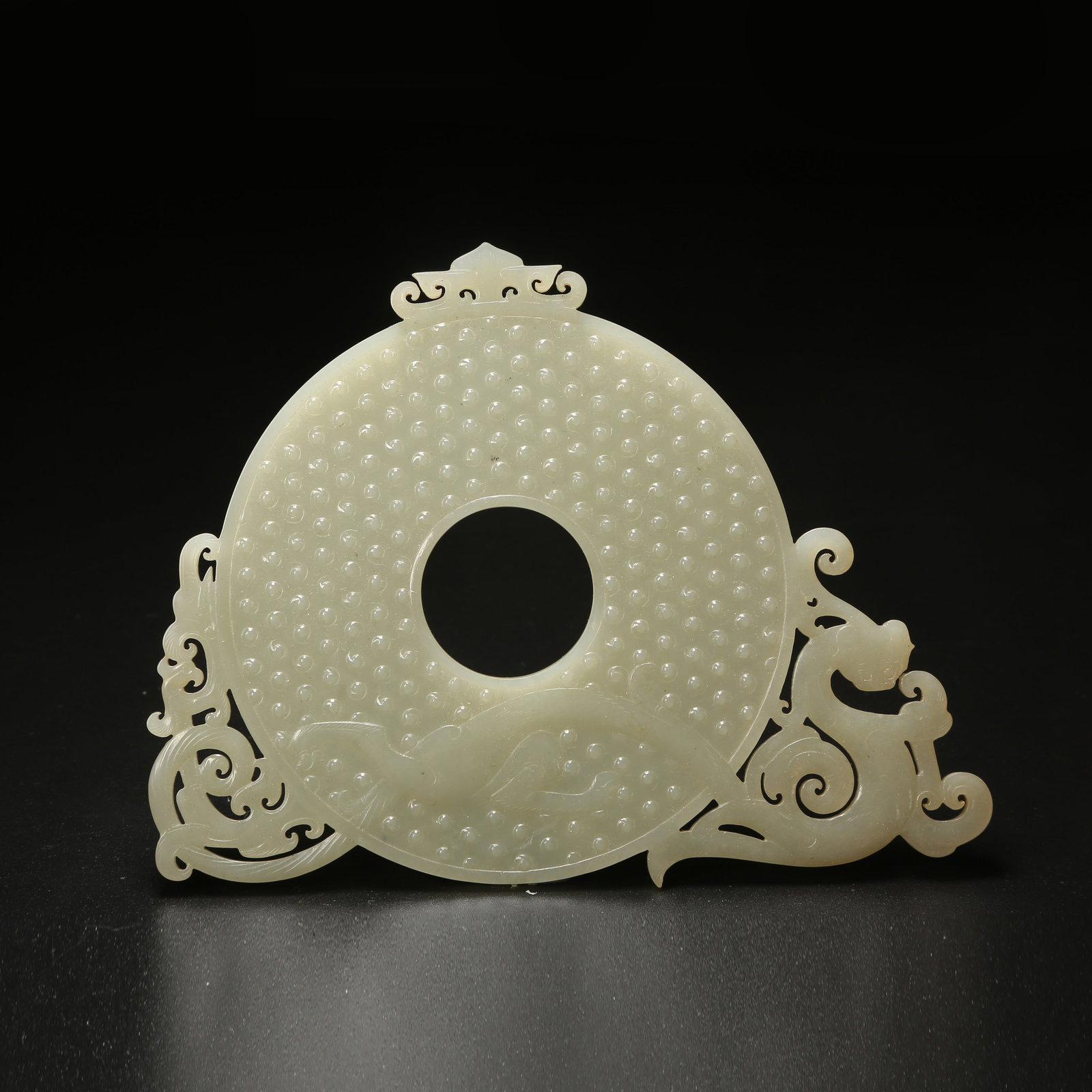 A HETIAN JADE DRAGON-PATTERNED BI WITH RAISED RIM (1 of 8)