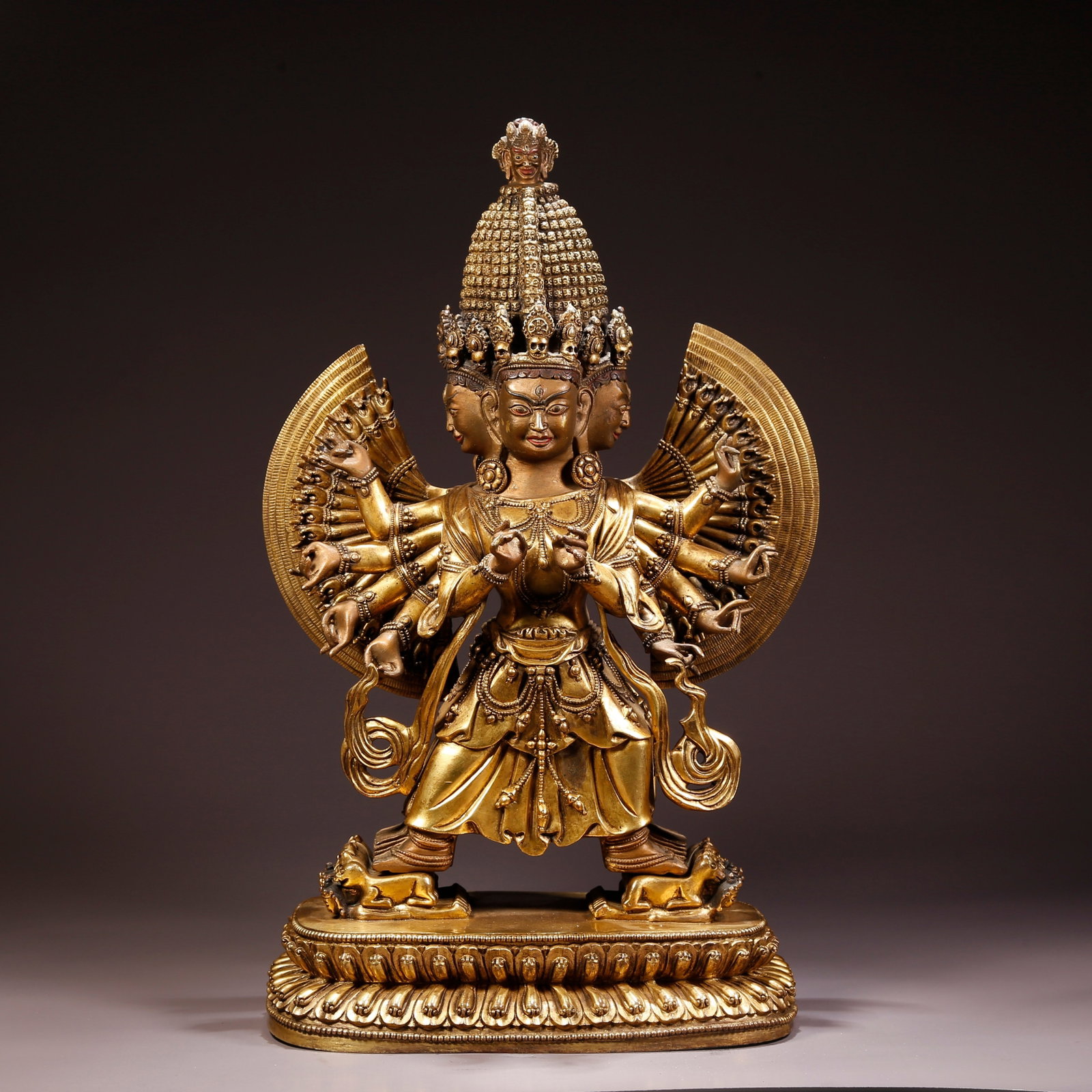 A GILT-BRONZE WHITE UMBRELLA-COVERED DAKINI FIGURE: Gilt-Bronze White Umbrella-Covered Dakini Figure