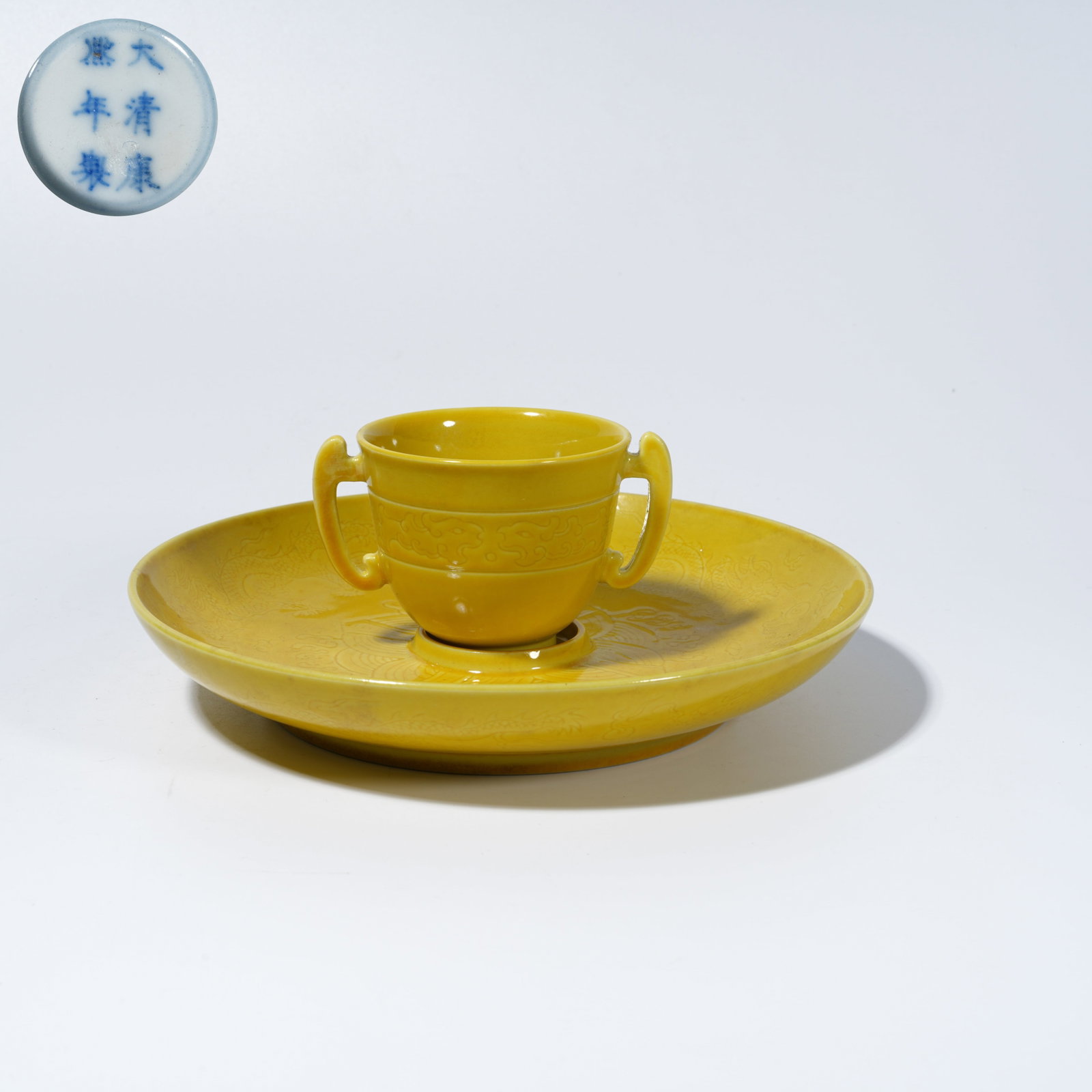 A YELLOW-GLAZED TEA BOWL WITH INCISED DOUBLE-DRAGON PLAYING PEARL MOTIF: Yellow-Glazed Tea Bowl with Incised Double-Dragon Playing Pearl Motif