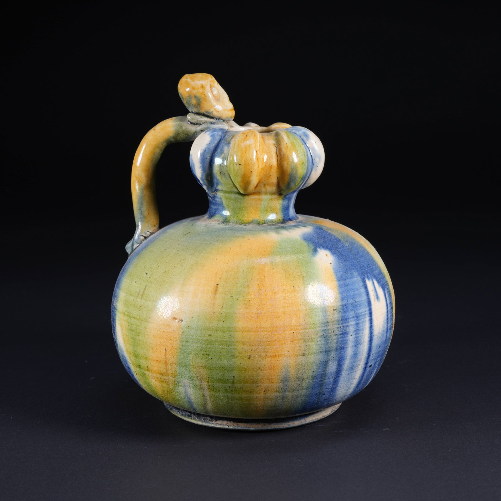 A TANG SANCAI EWER WITH FOREIGN FIGURE: Tang Sancai Ewer with Foreign Figure