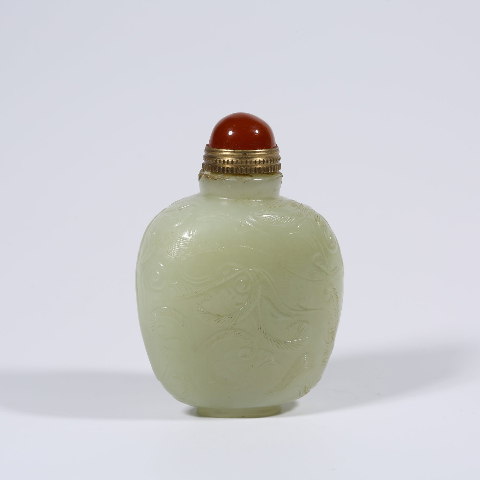 A HETIAN JADE SNUFF BOTTLE WITH CHI-DRAGON PATTERN (1 of 9)