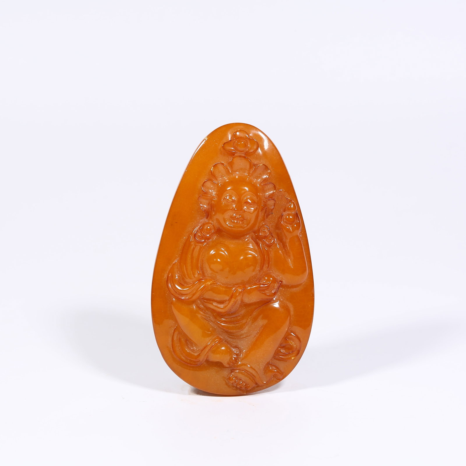 A AMBER BUDDHA PLAQUE: Amber Buddha Plaque