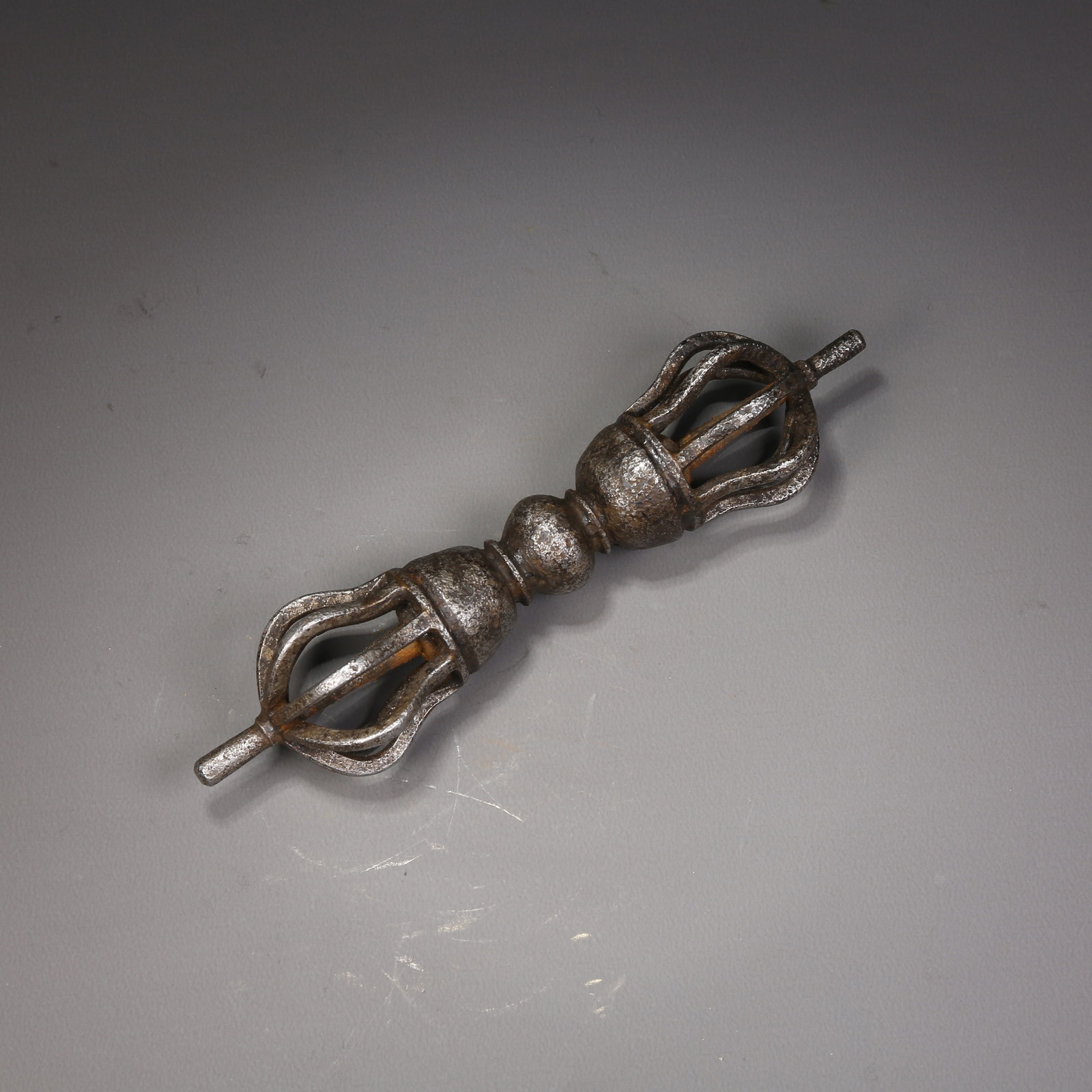 A IRON NINE-PRONGED VAJRA RITUAL IMPLEMENT: Iron nine-pronged vajra ritual implement