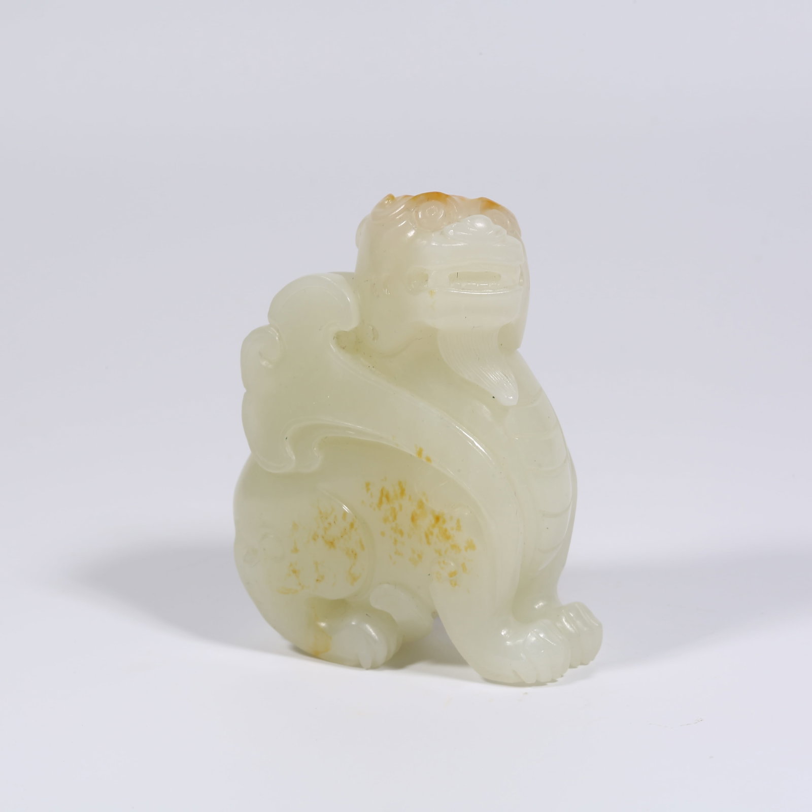 A HETIAN WHITE JADE AUSPICIOUS BEAST ORNAMENT (1 of 8)