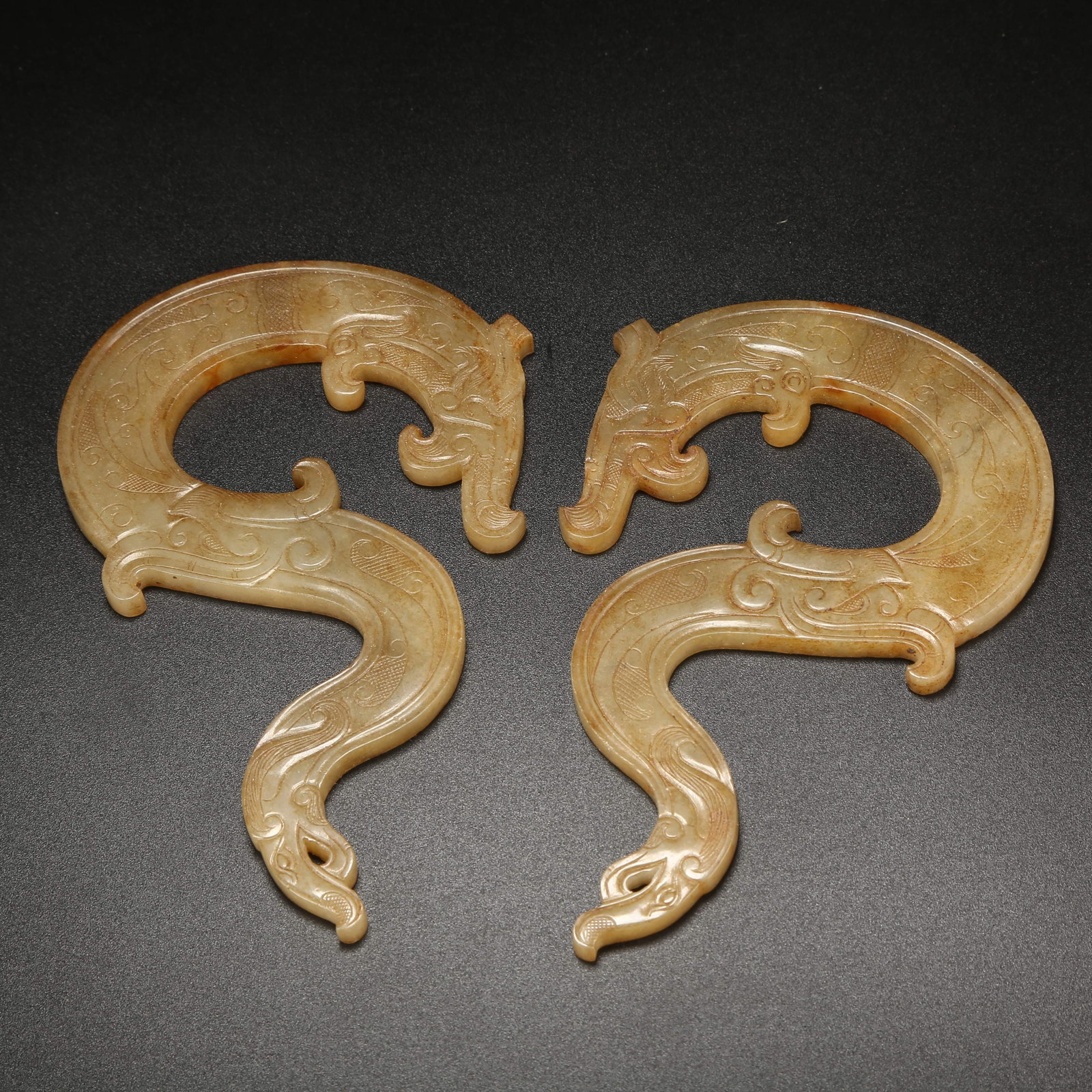 A SET OF ANCIENT JADE DRAGON-SHAPED PENDANTS (1 of 8)