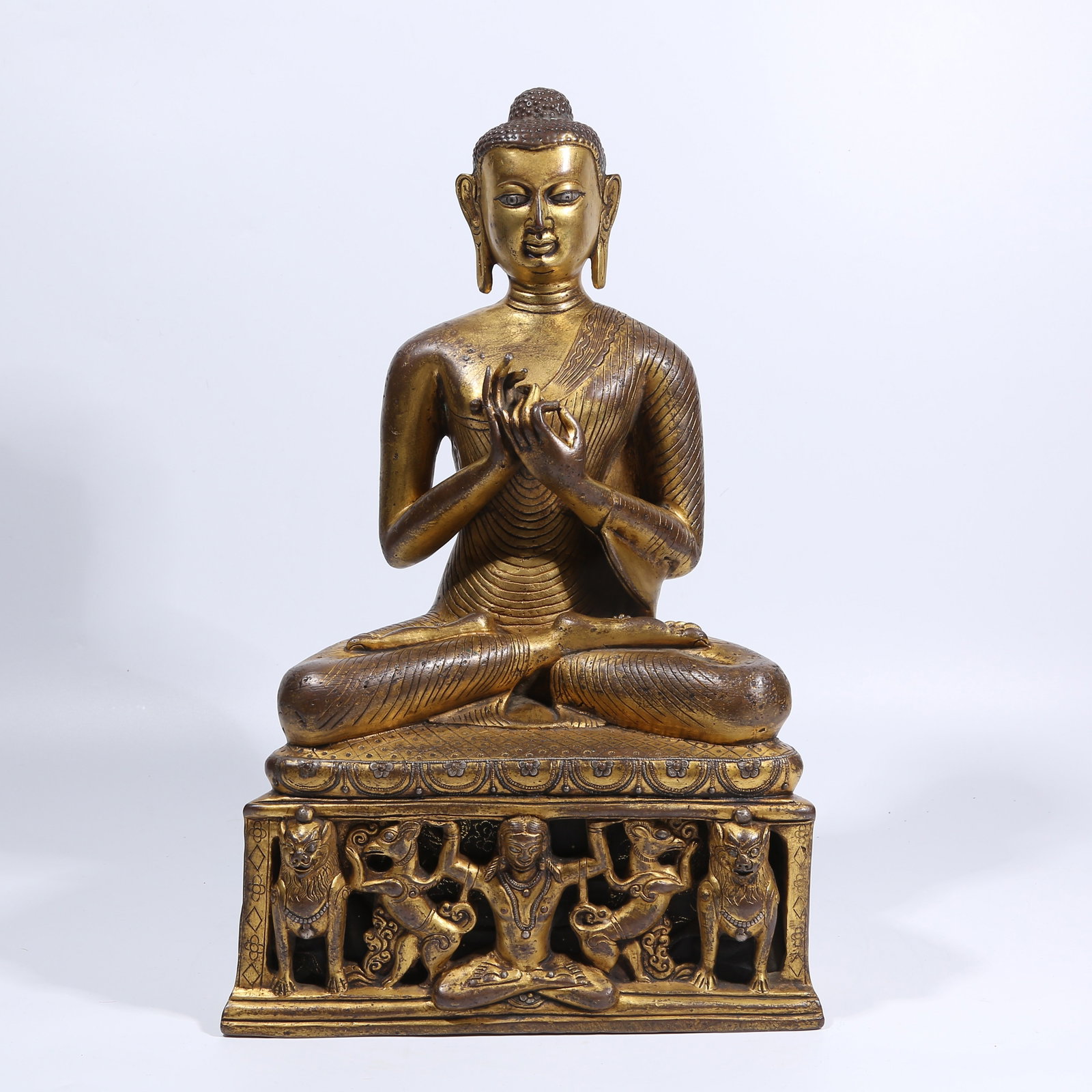 A GILT BRONZE SILVER-INLAID SHAKYAMUNI PREACHING STATUE: Gilt Bronze Silver-Inlaid Shakyamuni Preaching Statue