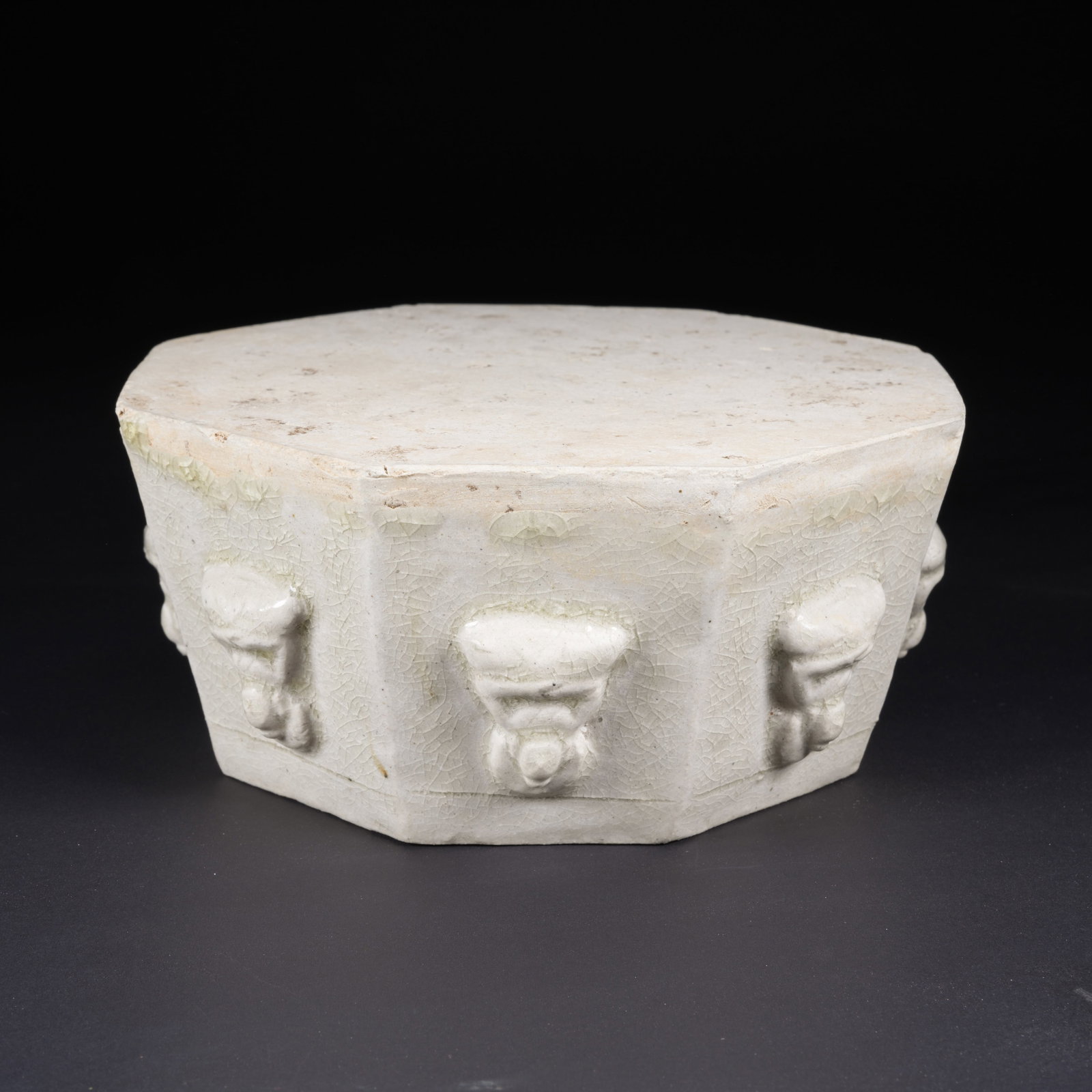 A WHITE-GLAZED CARVED PORCELAIN BUDDHA BASE FROM THE SUI DYNASTY (1 of 9)