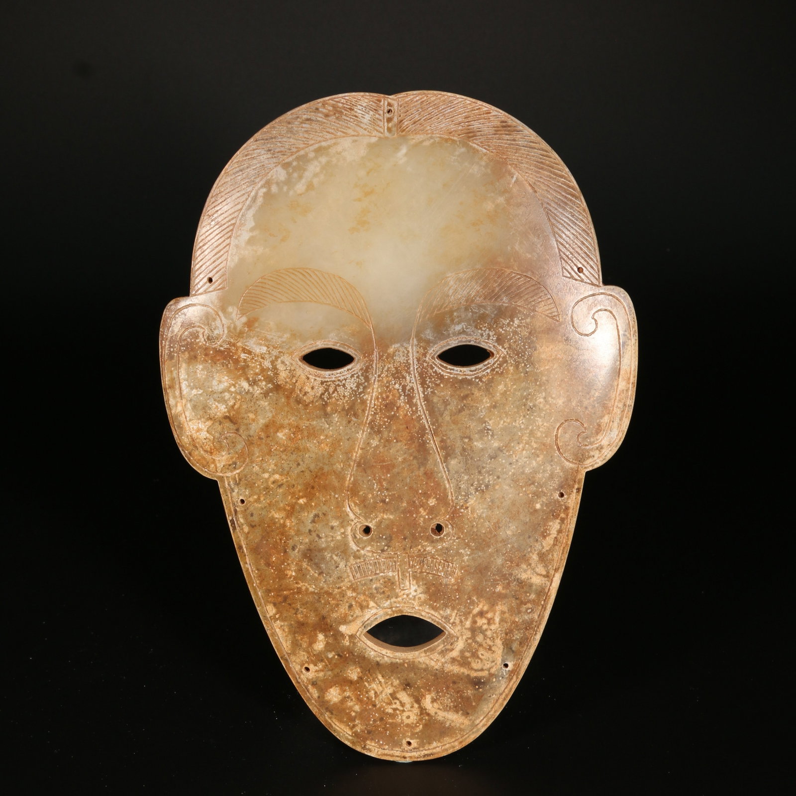 A ARCHAIC JADE MASK (1 of 9)