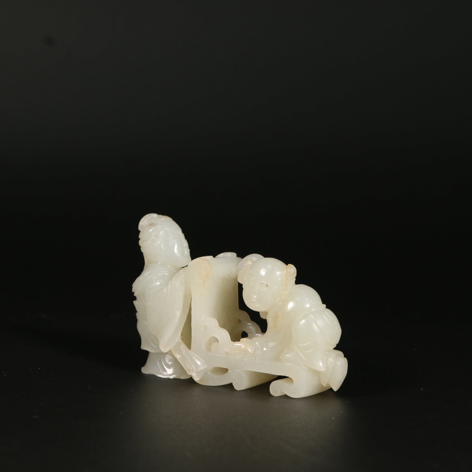 A HETIAN JADE FIGURINE (1 of 9)