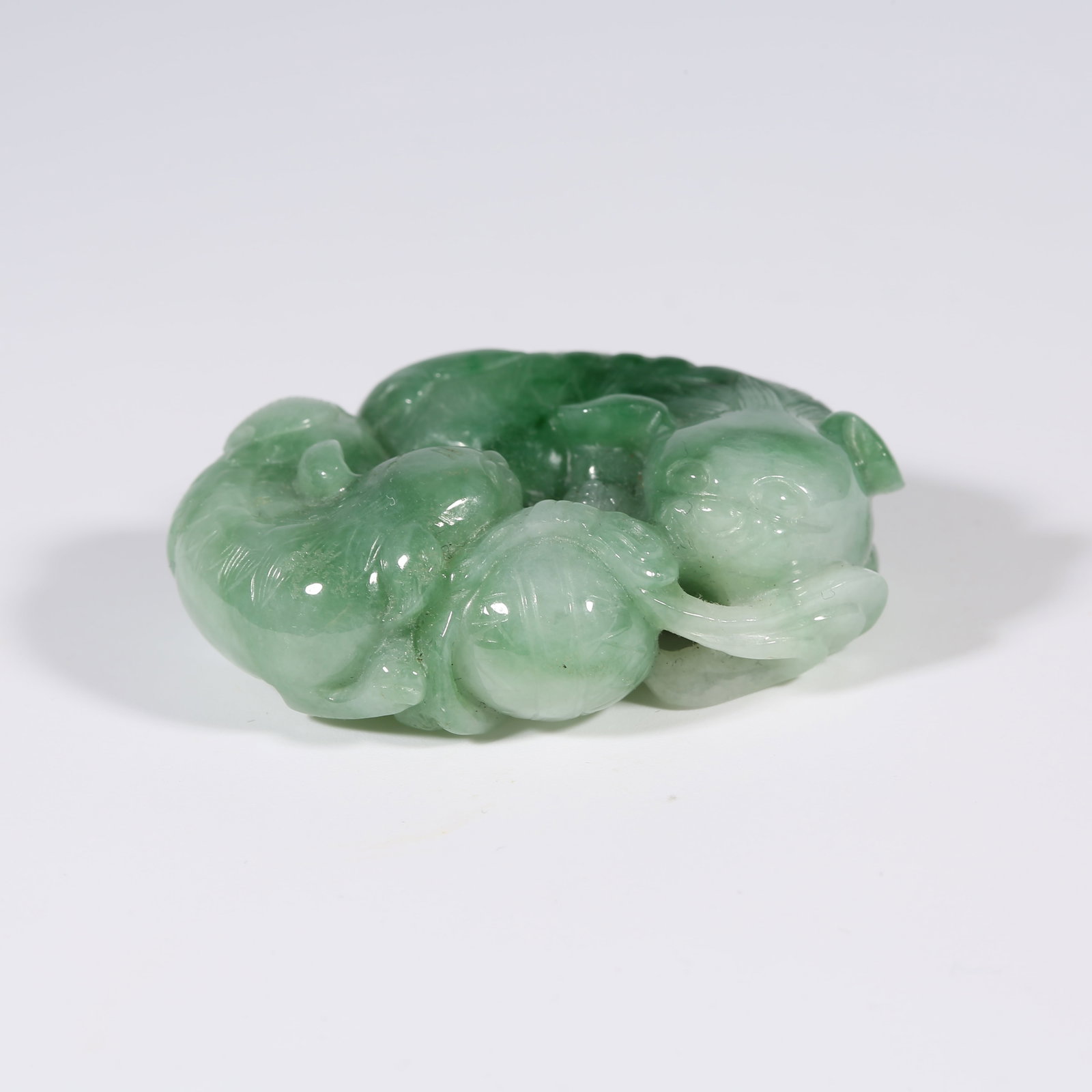 A JADEITE LARGE AND SMALL LION PENDANT: Jadeite Large and Small Lion Pendant