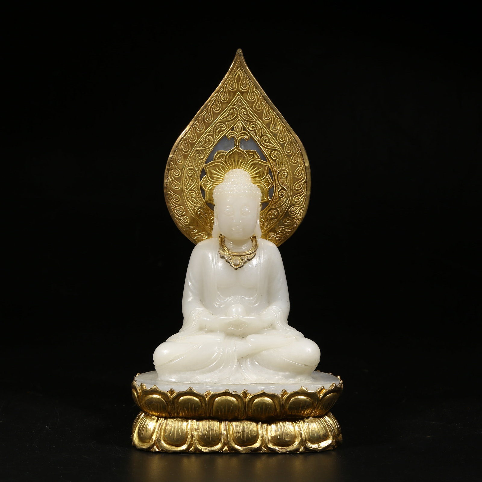 A HETIAN WHITE JADE SHAKYAMUNI SCULPTURE: Hetian white jade Shakyamuni sculpture