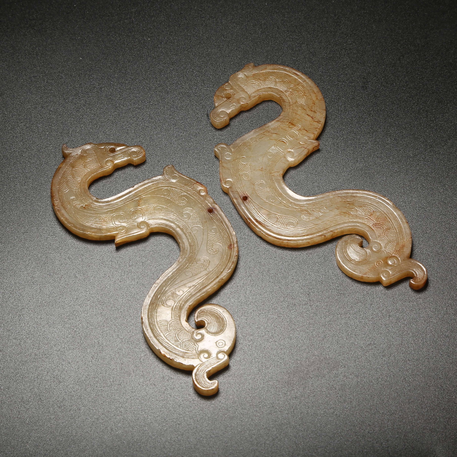 A SET OF ANCIENT JADE S-SHAPED DRAGON PENDANTS (1 of 9)