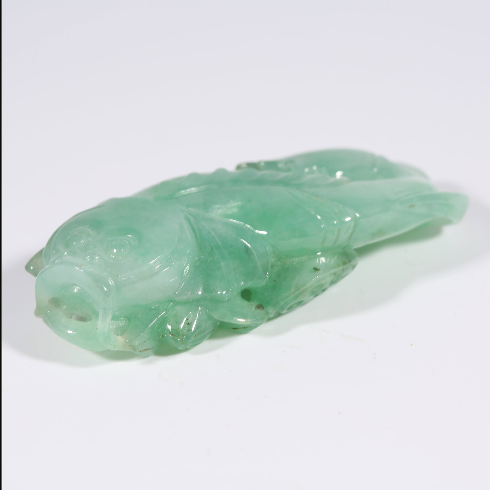 A JADEITE PENDANT WITH "ABUNDANCE YEAR AFTER YEAR" MOTIF (1 of 8)