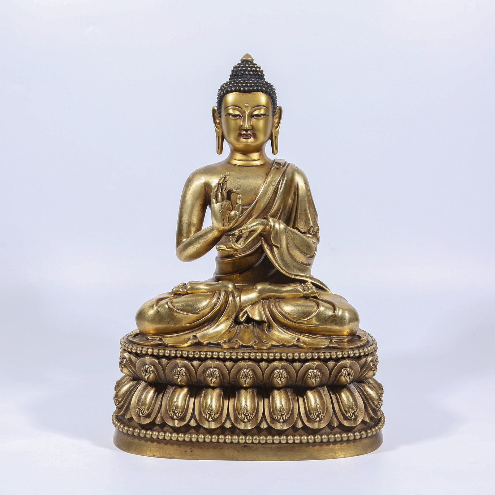 A GILT BRONZE DIPANKARA BUDDHA STATUE: Gilt Bronze Dipankara Buddha Statue