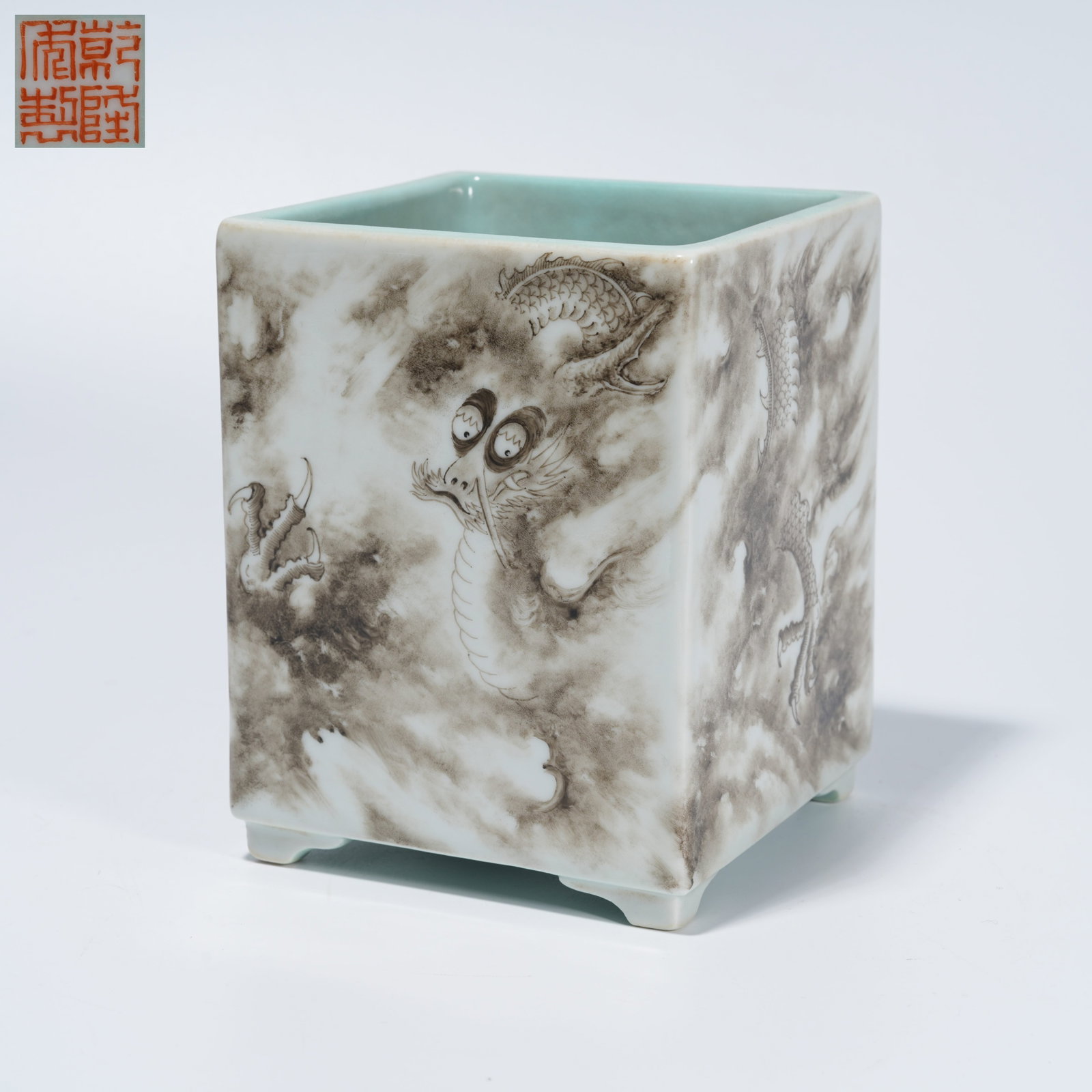 A INK-AND-COLOR BRUSH POT WITH CLOUD-AND-DRAGON MOTIF: Ink-and-Color Brush Pot with Cloud-and-Dragon Motif