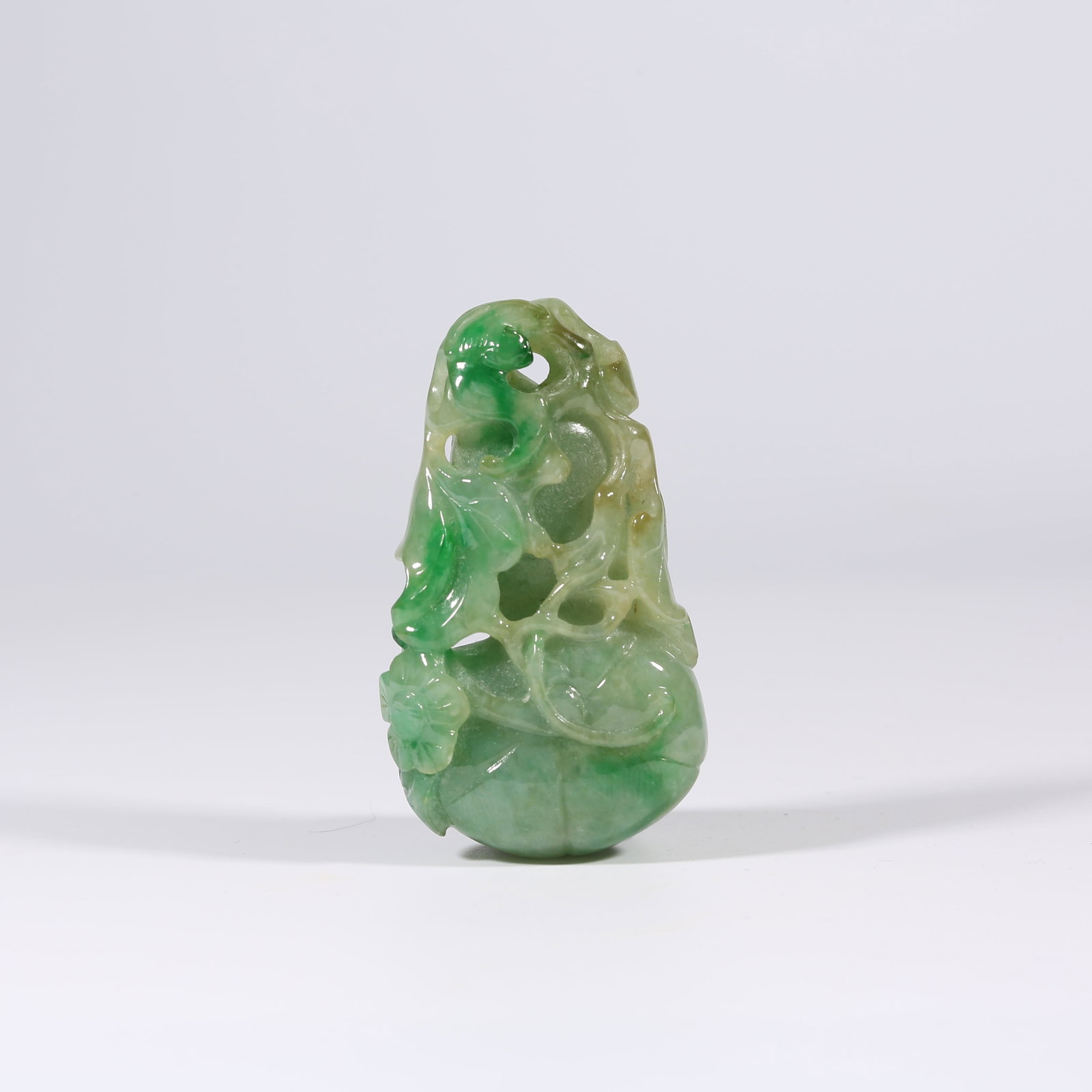 A JADEITE PENDANT WITH LUCKY MELON MOTIF (1 of 8)