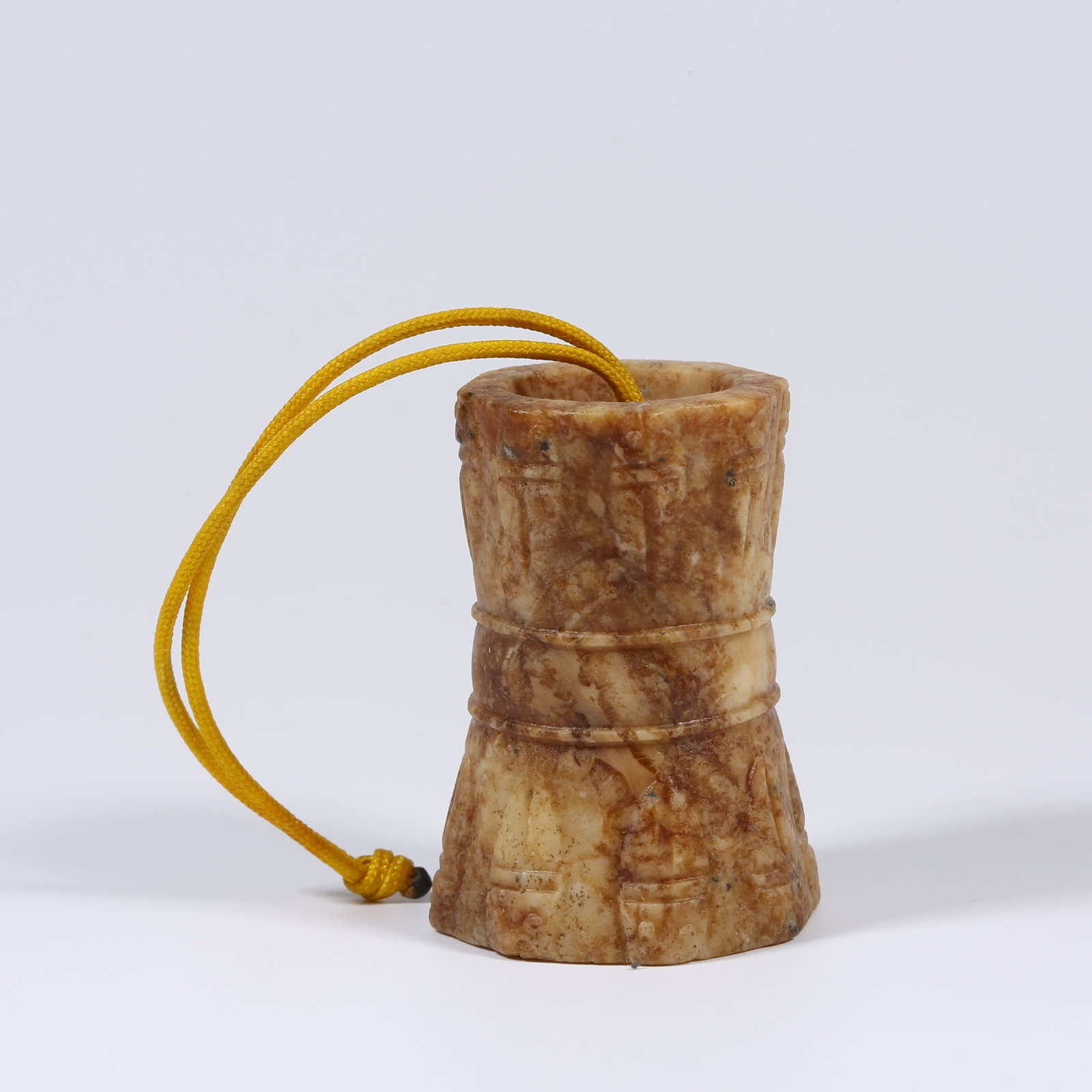 A ANCIENT JADE RIBBON-SHAPED PENDANT: Ancient Jade Ribbon-Shaped Pendant