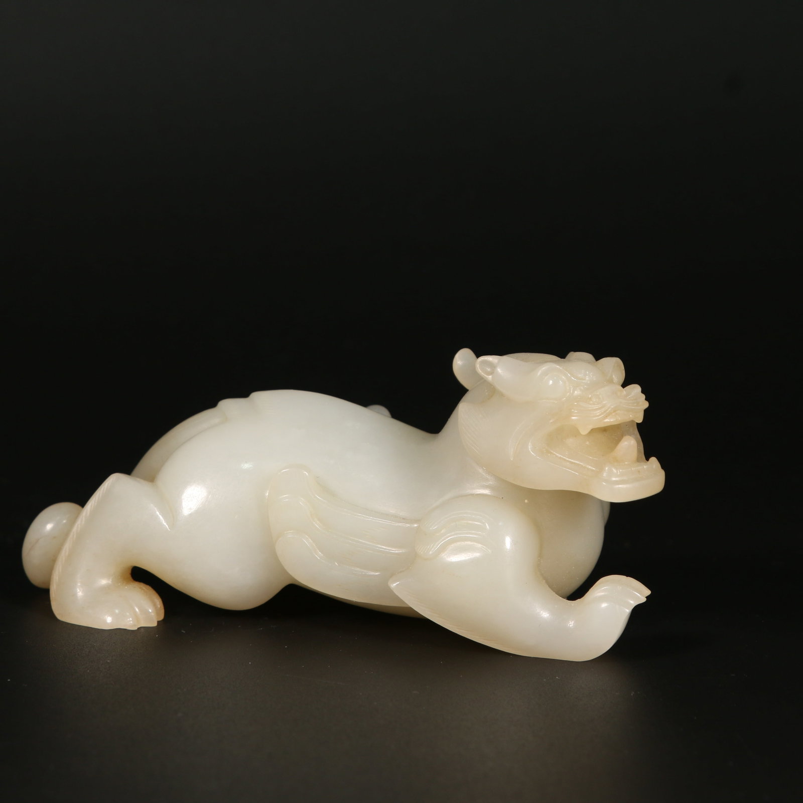 A HETIAN JADE GUARDIAN BEAST FIGURINE (1 of 11)