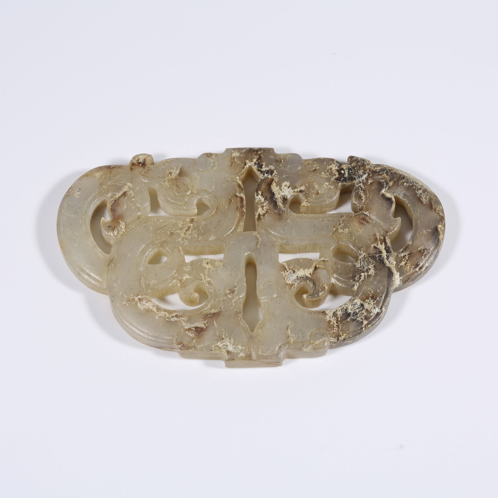 A ANCIENT JADE DOUBLE DRAGON PENDANT (1 of 9)