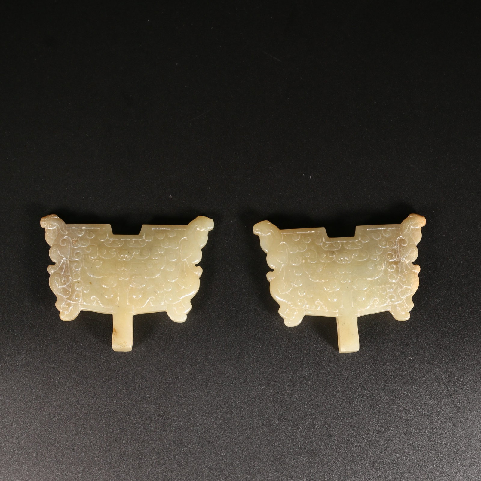 A SET OF HETIAN JADE FU-HEAD ORNAMENTS (1 of 13)