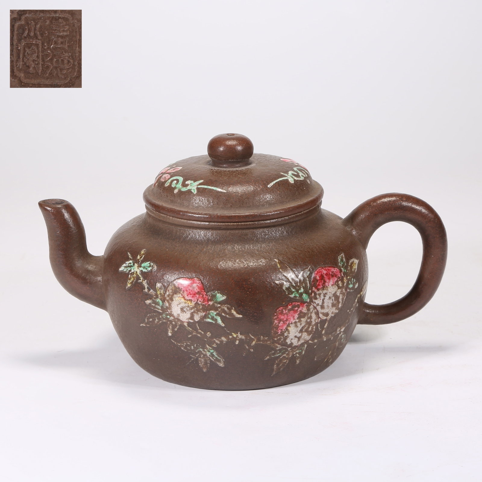 A YIXING (ZISHA) TEAPOT CARVED WITH LONGEVITY-PEACH PATTERN: Yixing (zisha) teapot carved with longevity-peach pattern