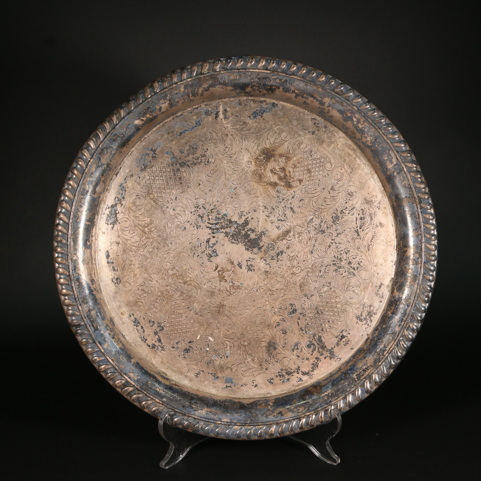 A SILVER FOLDING RIM PLATE WITH SCROLL AND GRASS DESIGN (1 of 11)