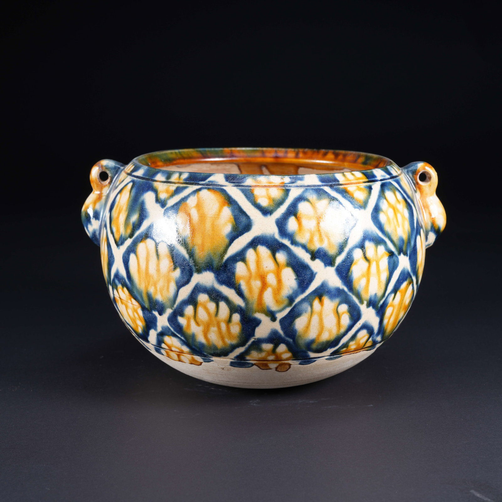 A TANG SANCAI JAR WITH DOUBLE LOOP HANDLES: Tang Sancai Jar with Double Loop Handles