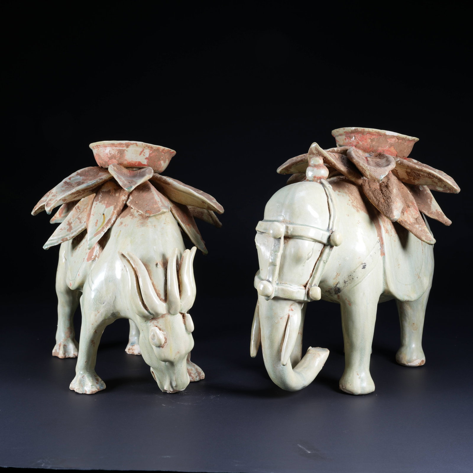 A CELADON AUSPICIOUS BEAST LOTUS-BASE CANDLESTICK (1 of 10)