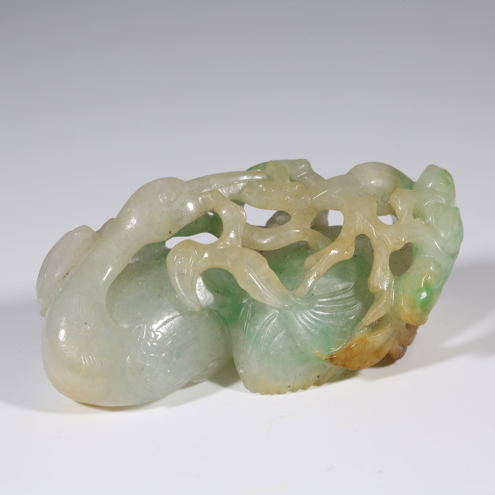 A JADEITE ORNAMENT OF GOOSE HOLDING A BRANCH: Jadeite Ornament of Goose Holding a Branch