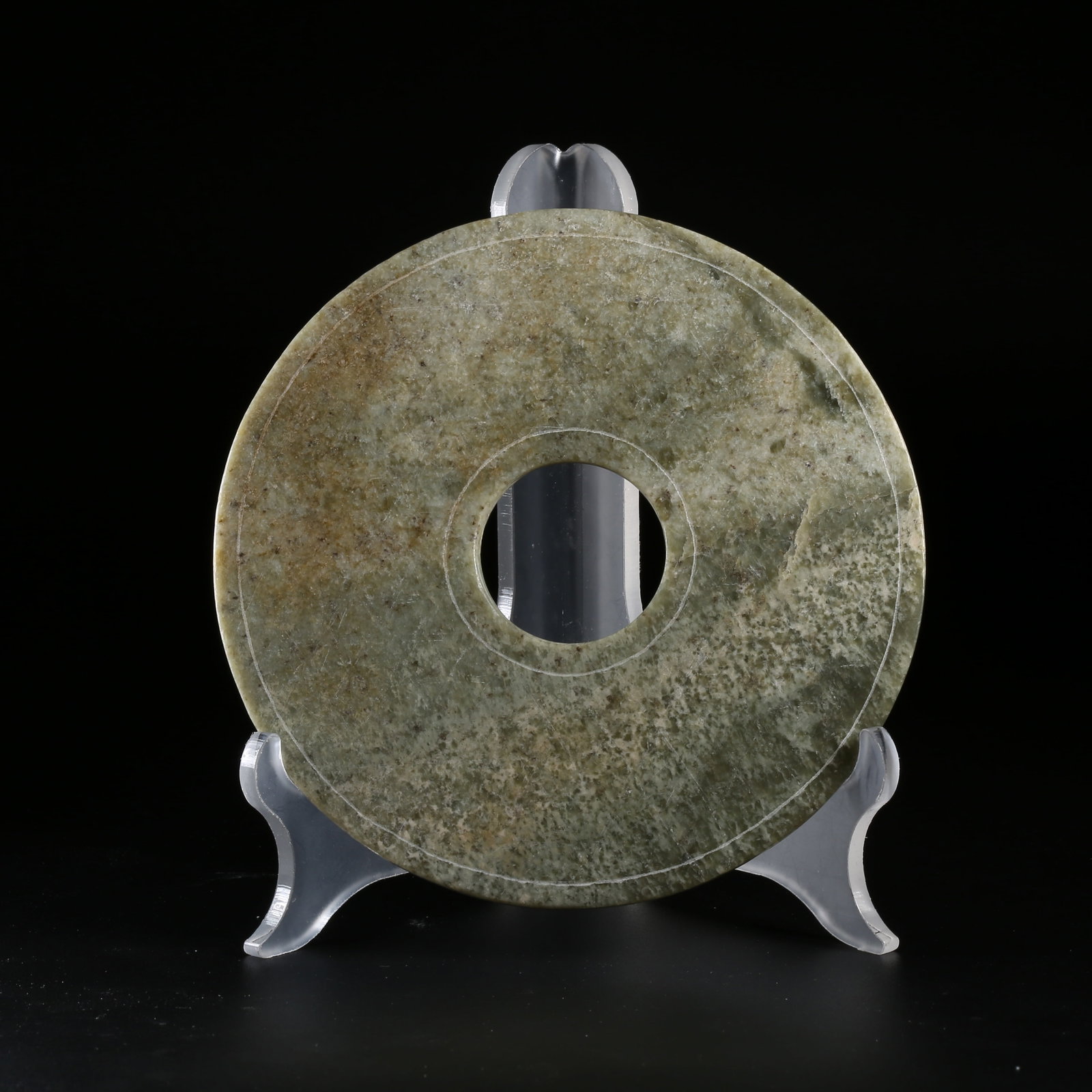 A ANCIENT JADE BI WITH INCISED ANGULAR PATTERN: Ancient Jade Bi with Incised Angular Pattern