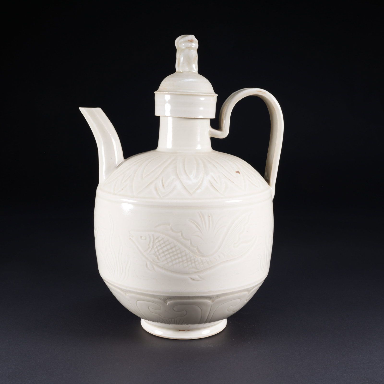 A DING KILN EWER WITH FISH AND ALGAE PATTERN: Ding Kiln Ewer with Fish and Algae Pattern