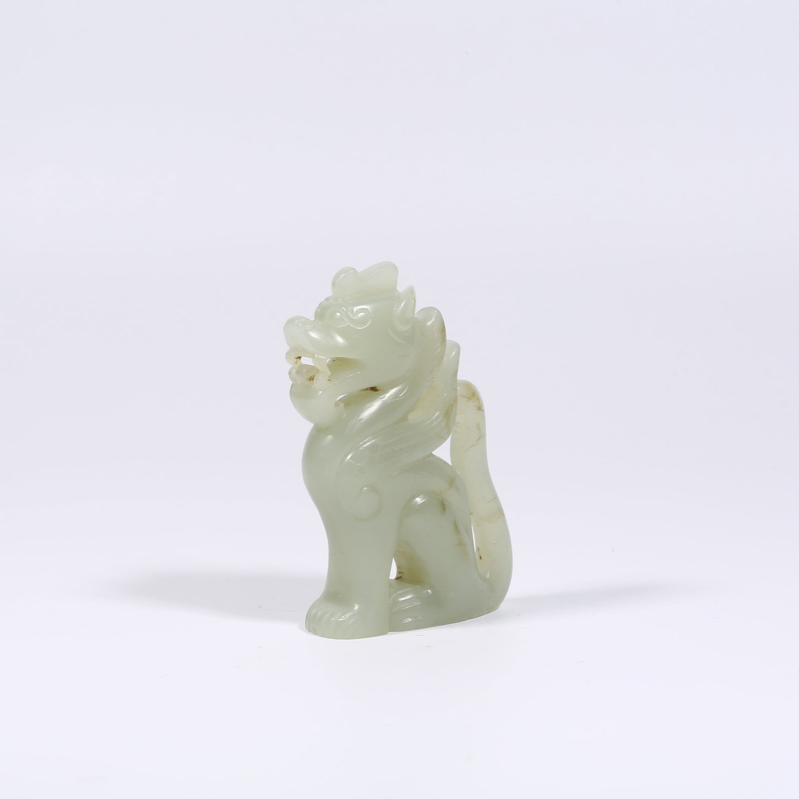 A HETIAN JADE SITTING DRAGON (1 of 9)