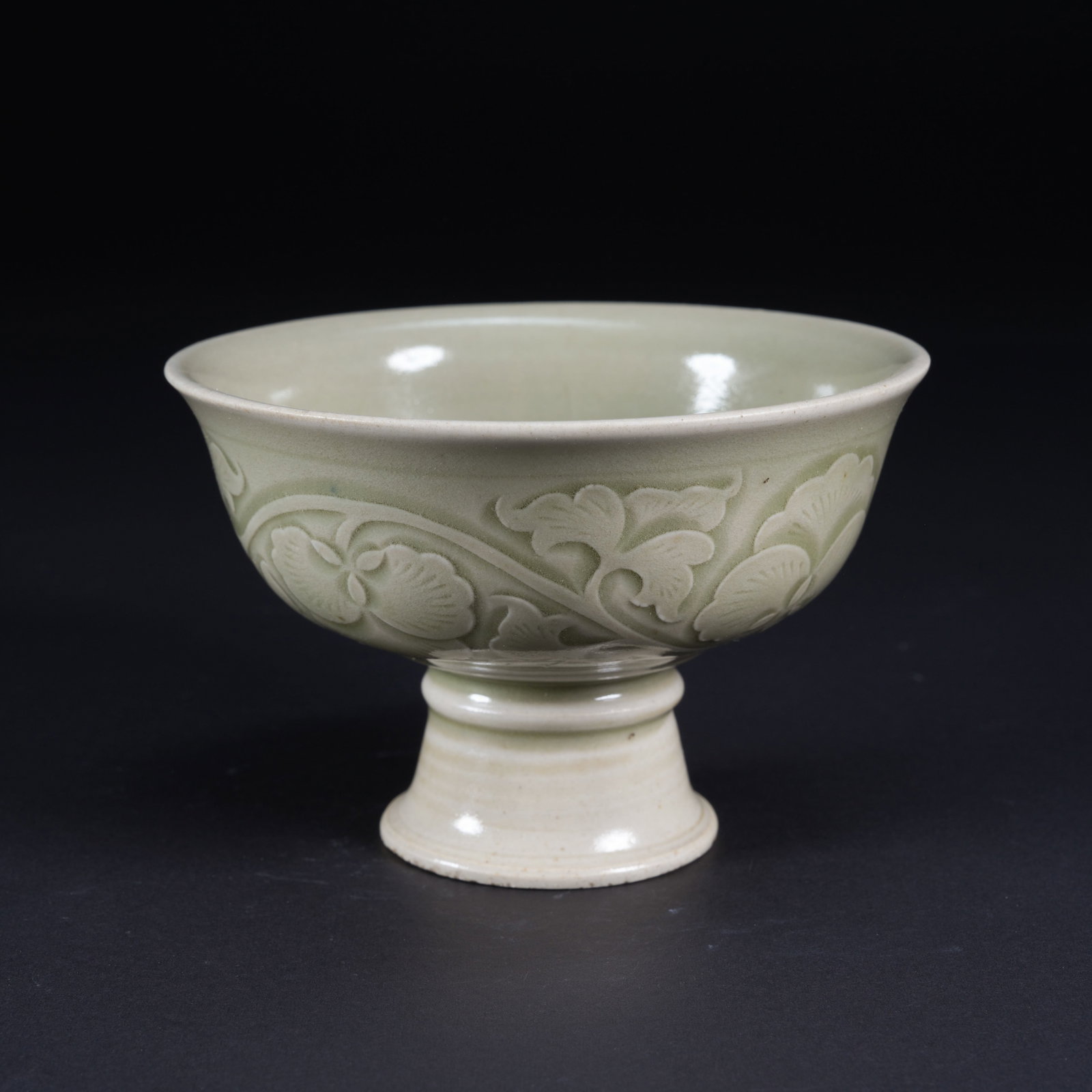 A CELADON CARVED HIGH-FOOT CUP (1 of 9)