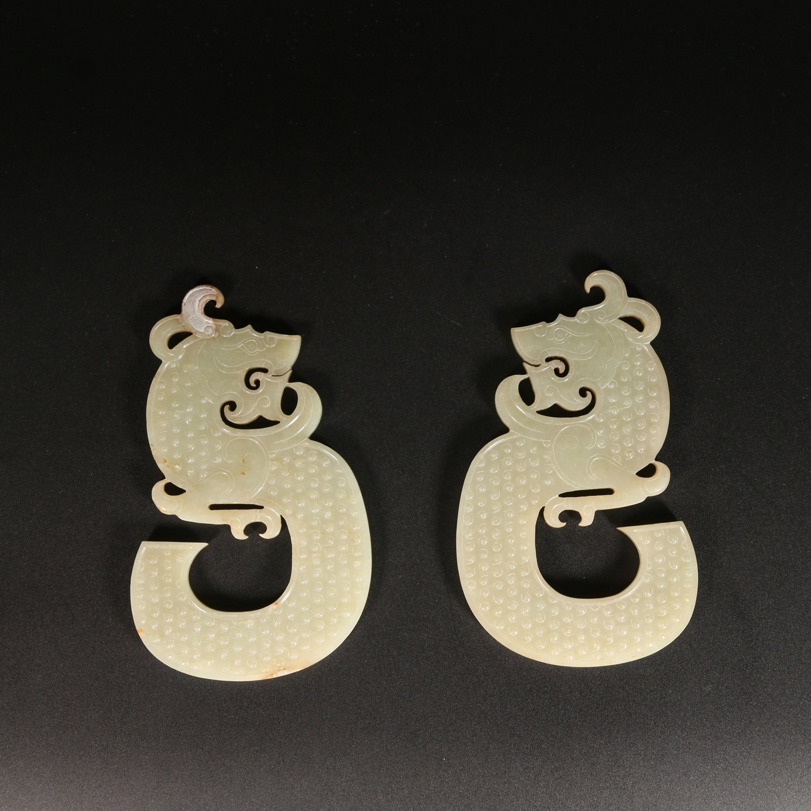 A SET OF HETIAN JADE DRAGON-SHAPED PENDANTS (1 of 10)