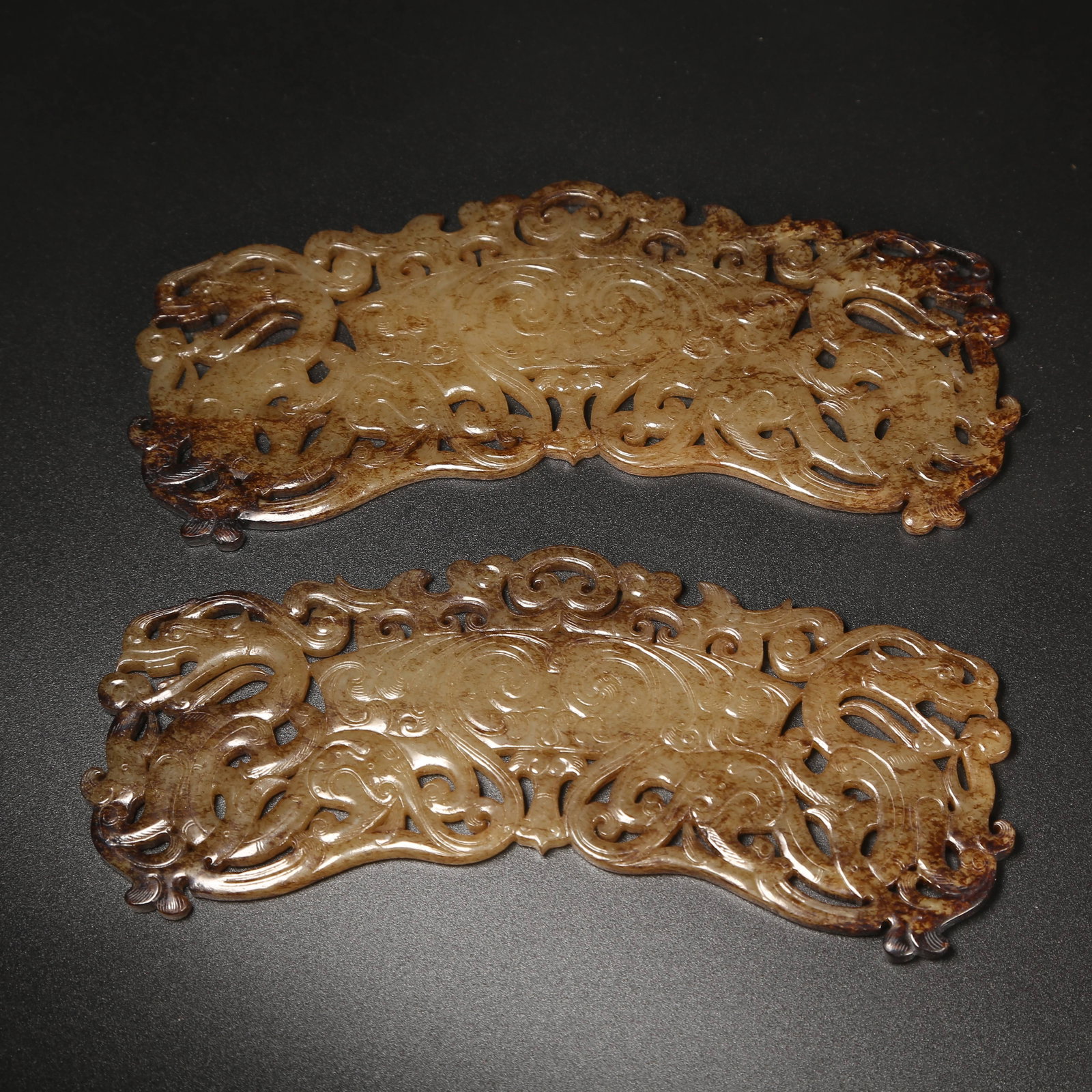 A SET OF ANCIENT JADE DOUBLE DRAGON-HEAD HUANG PENDANTS: Set of Ancient Jade Double Dragon-Head Huang Pendants