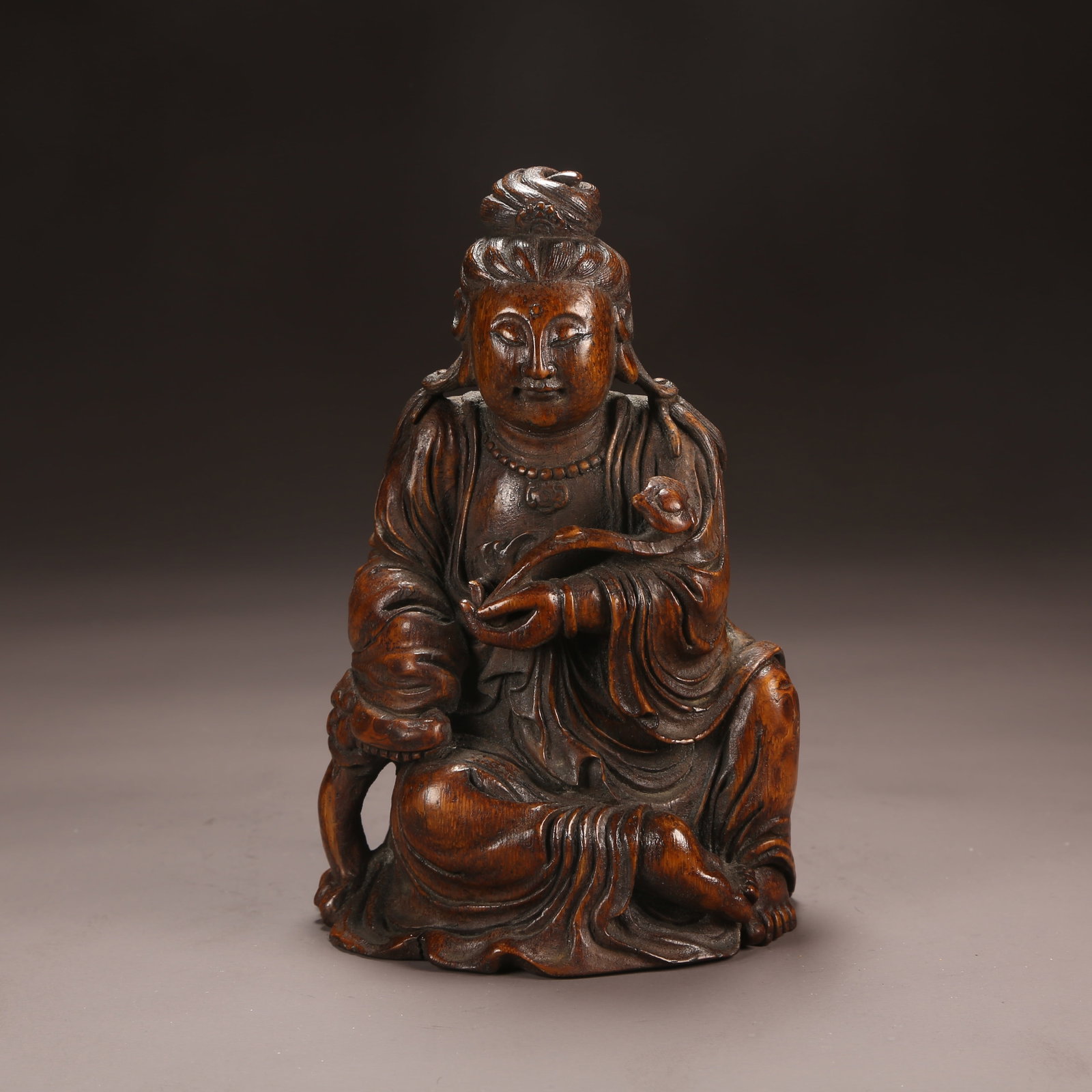 A BAMBOO ROOT CARVED SEATED GUANYIN: Bamboo Root Carved Seated Guanyin