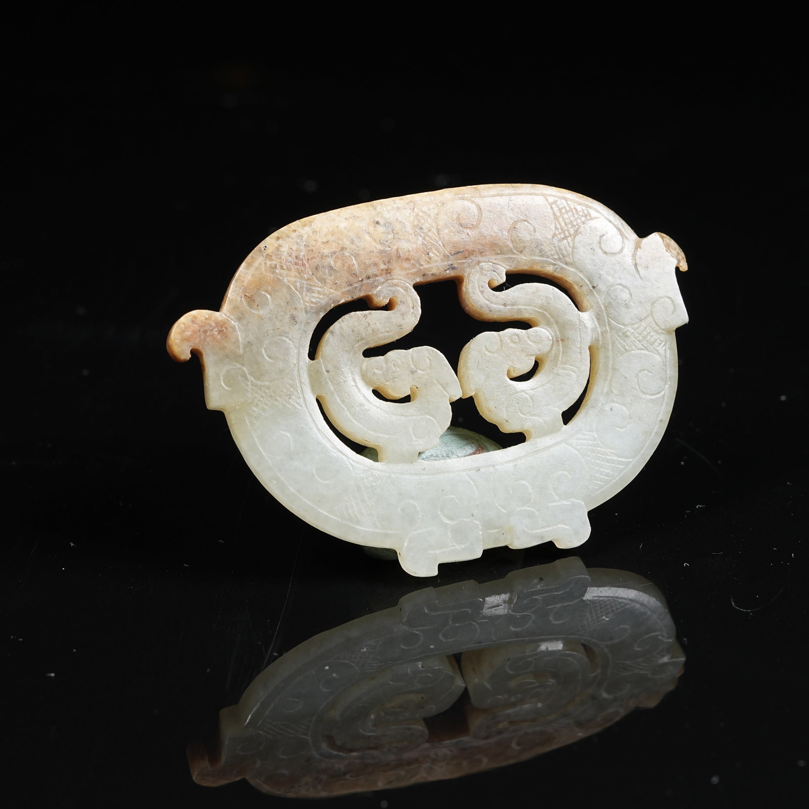 A ANCIENT JADE DOUBLE DRAGON PENDANT (1 of 8)