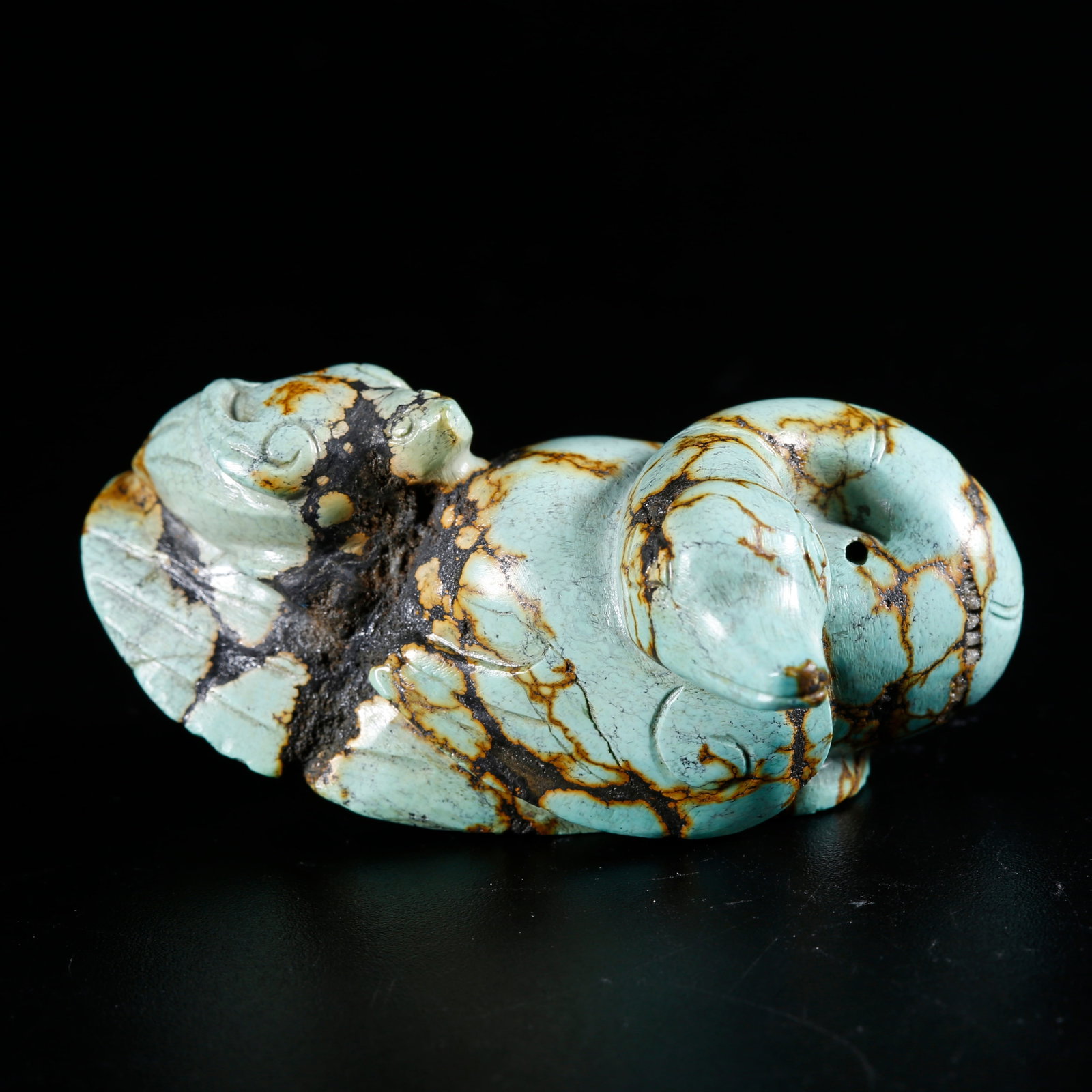 A TURQUOISE CARVED ORNAMENT IN GOSHAWK PECKING WILD GOOSE SHAPE: Turquoise Carved Ornament in Goshawk Pecking Wild Goose Shape