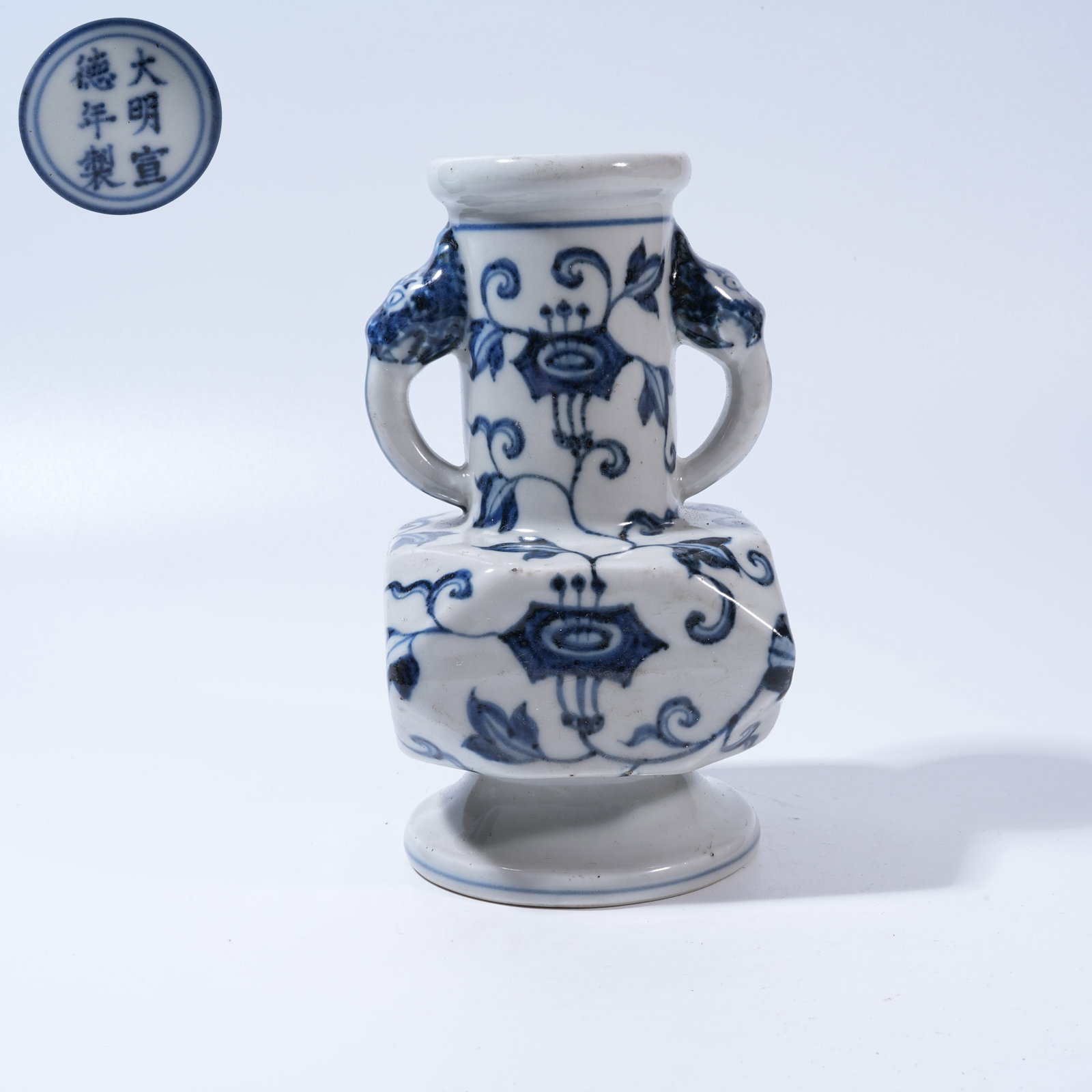 A BLUE-AND-WHITE ZUN VESSEL WITH FLORAL MOTIFS AND BEAST-HEAD HANDLES (1 of 9)