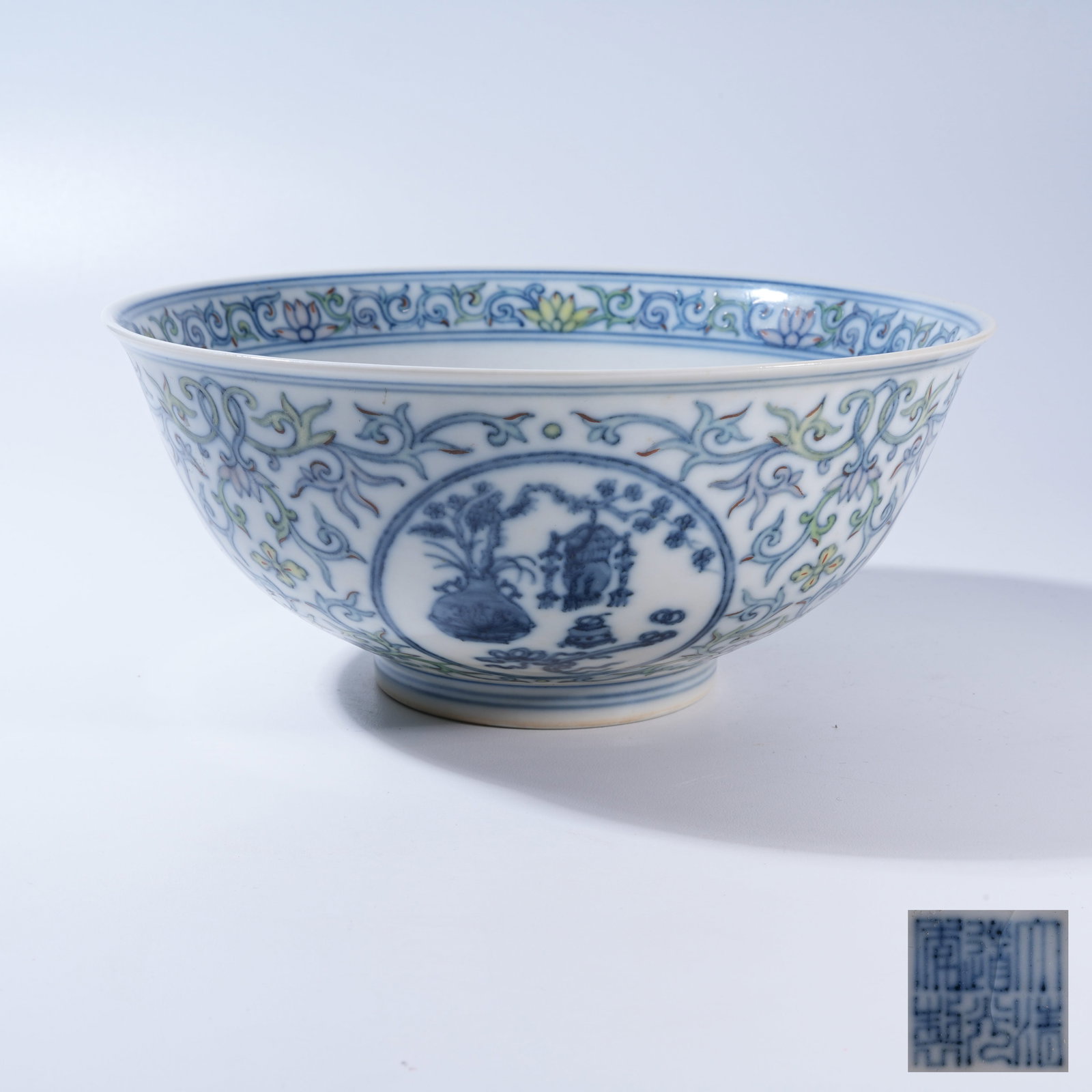 A BLUE-AND-WHITE DOUCAI BOWL WITH "EIGHT TREASURES" MOTIF: Blue-and-White Doucai Bowl with "Eight Treasures" Motif